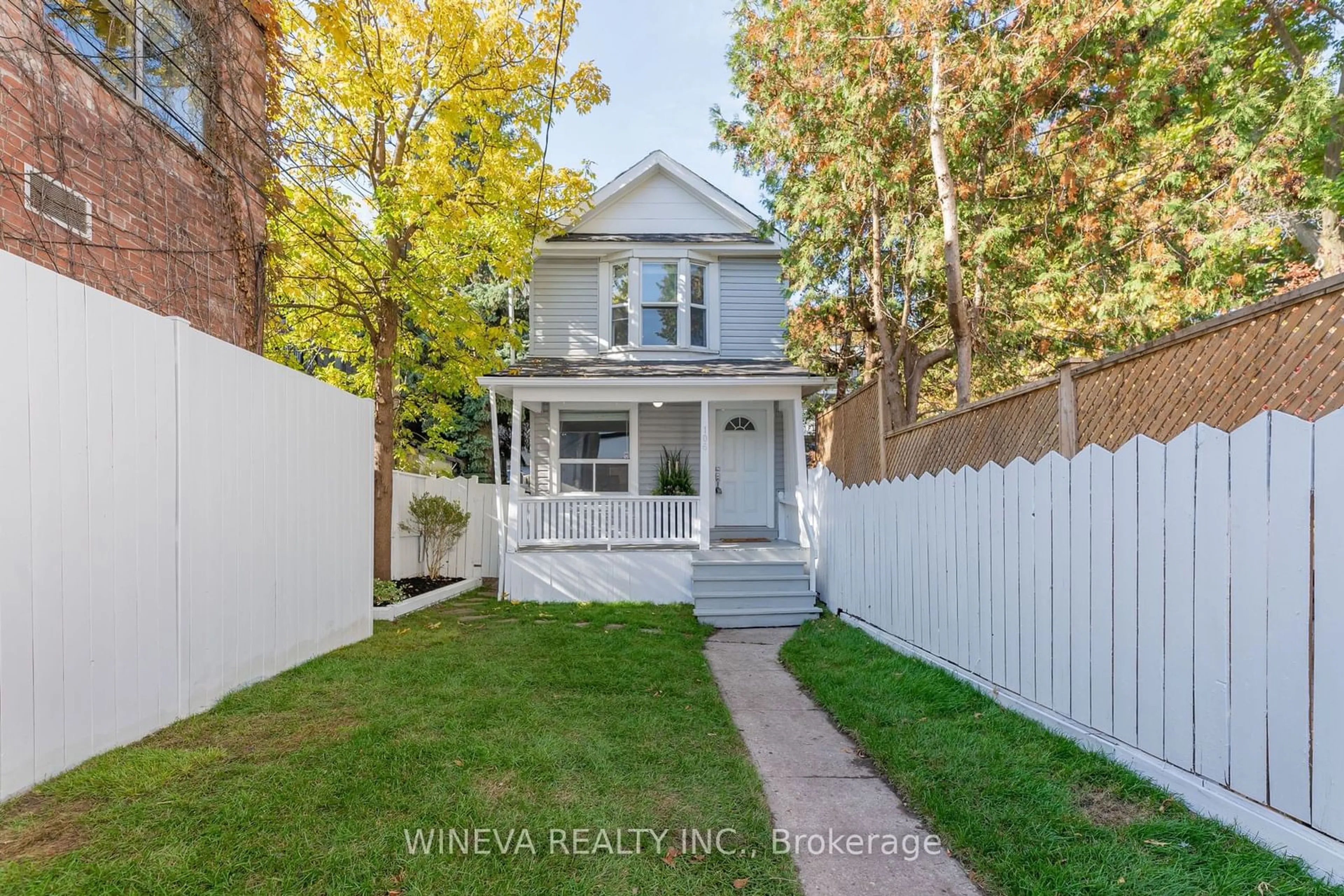 Frontside or backside of a home, the fenced backyard for 106 Willow Ave, Toronto Ontario M4E 3K3