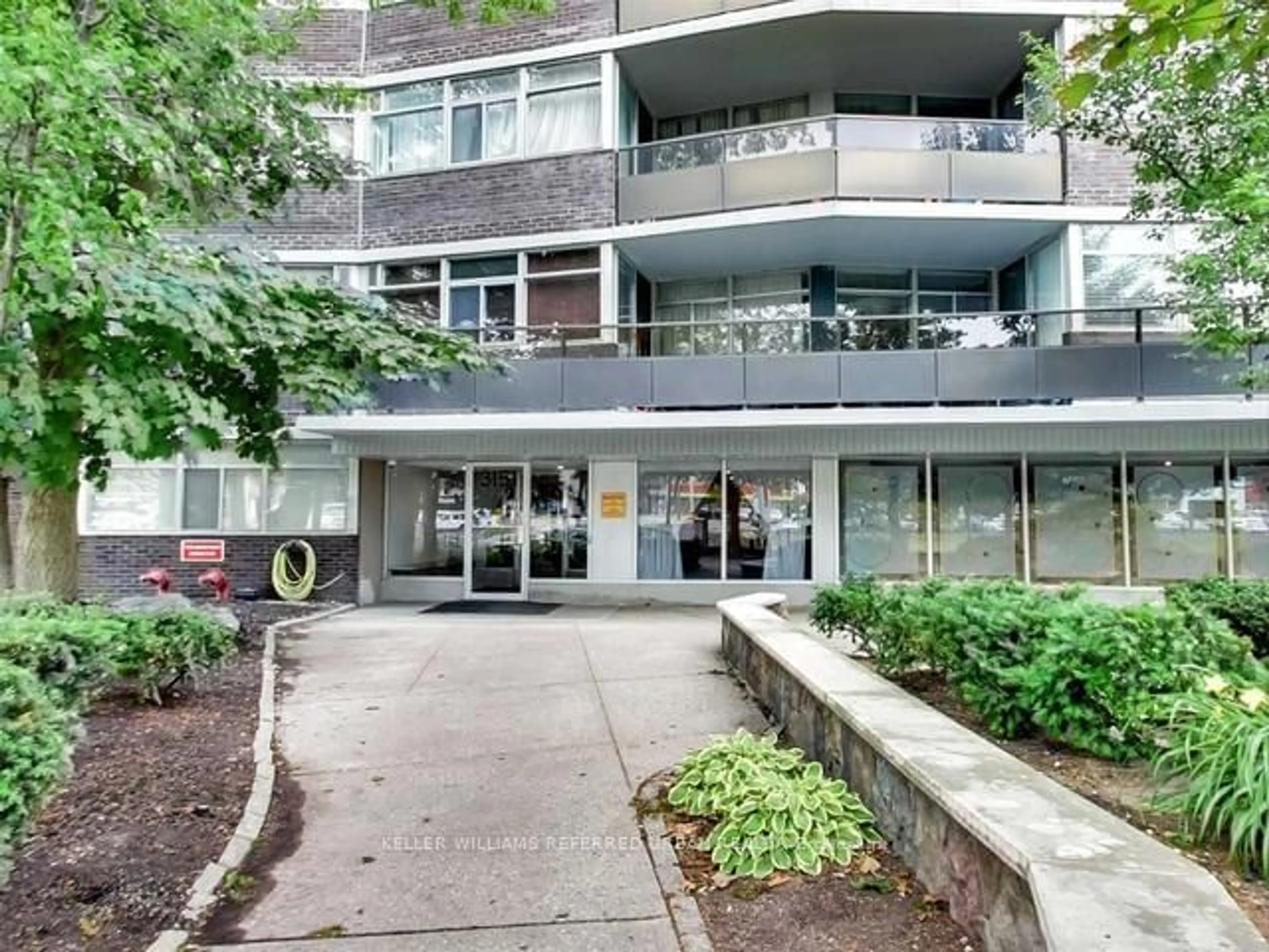 A pic from exterior of the house or condo, the front or back of building for 3151 Bridletowne Circ #305, Toronto Ontario M1W 2T1