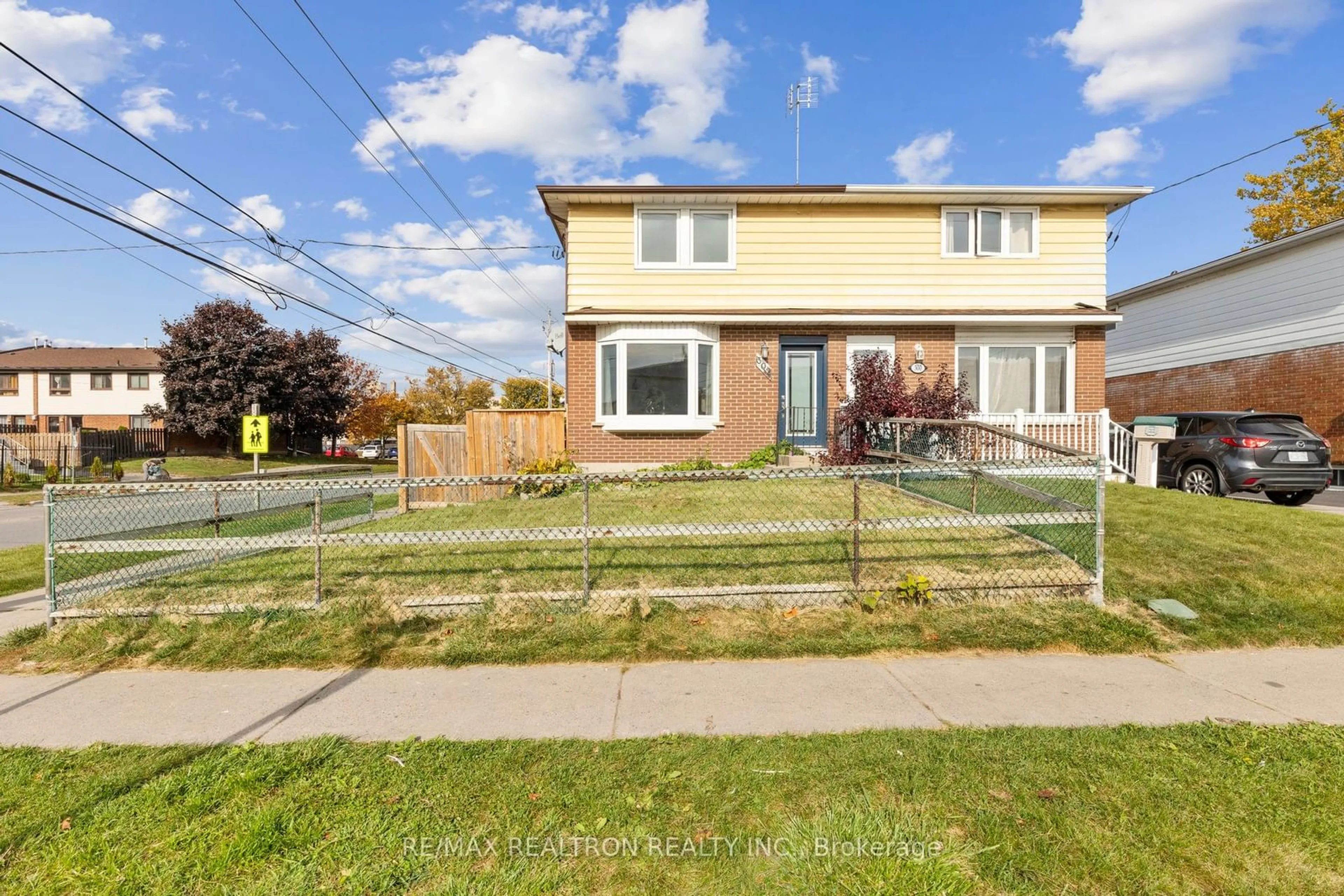 Frontside or backside of a home, the fenced backyard for 302 Porter St, Oshawa Ontario L1J 1N4