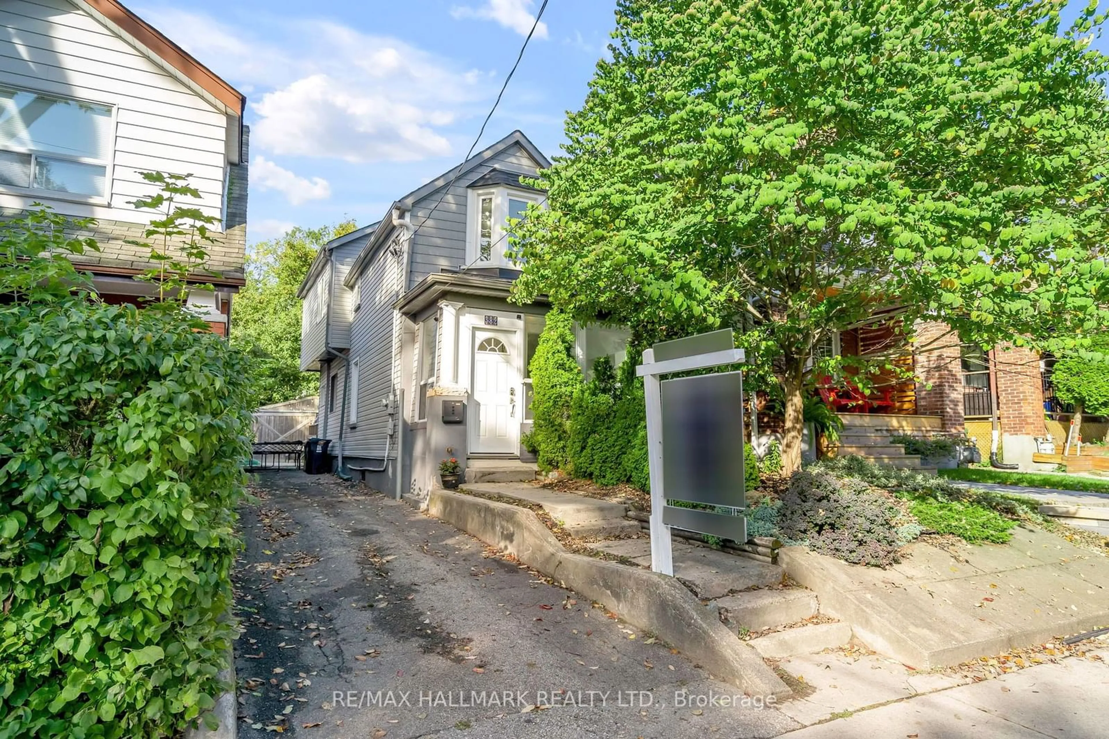 Frontside or backside of a home, the street view for 382 Rhodes Ave, Toronto Ontario M4L 3A5