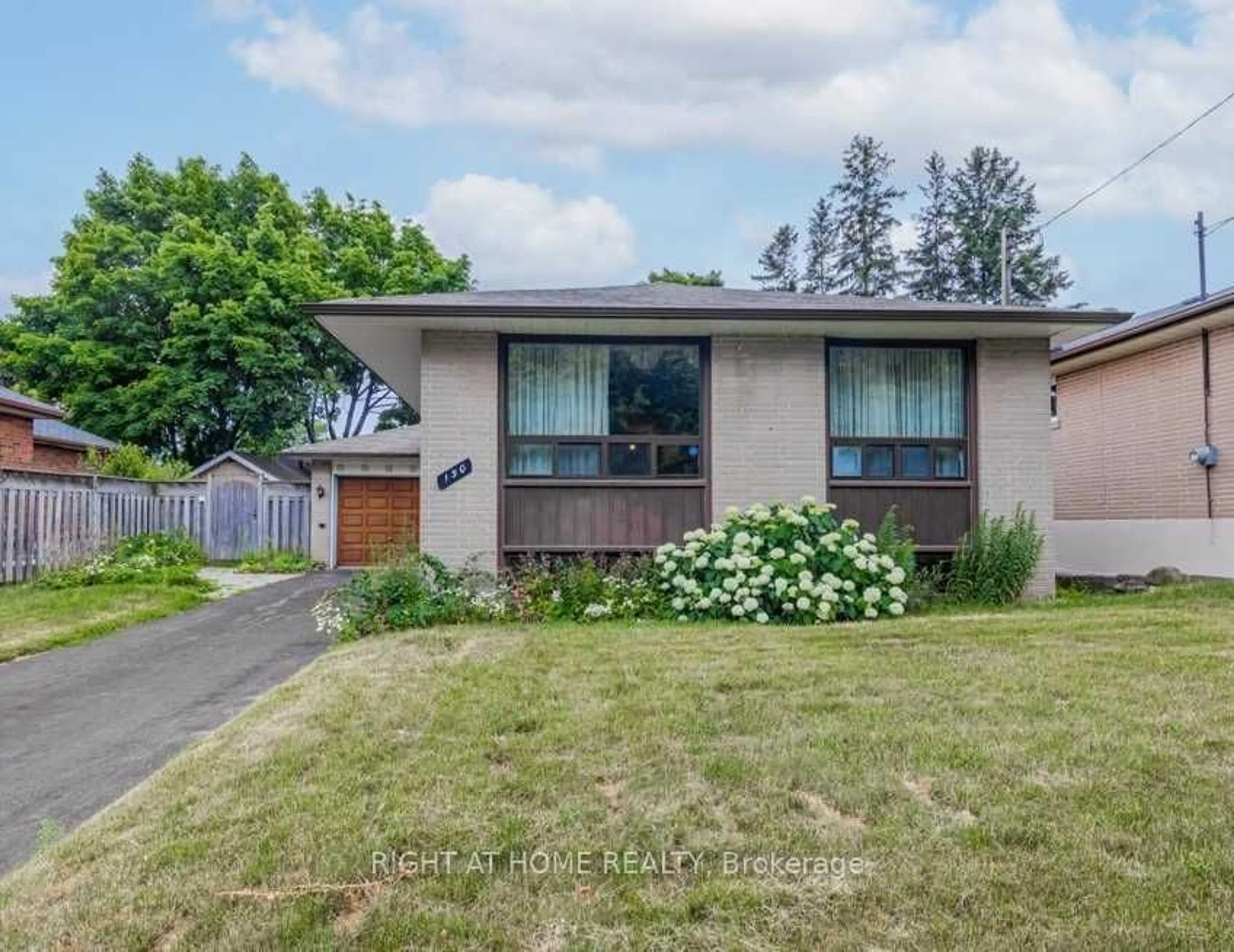 Frontside or backside of a home, the fenced backyard for 150 Lord Roberts Dr, Toronto Ontario M1K 3W8