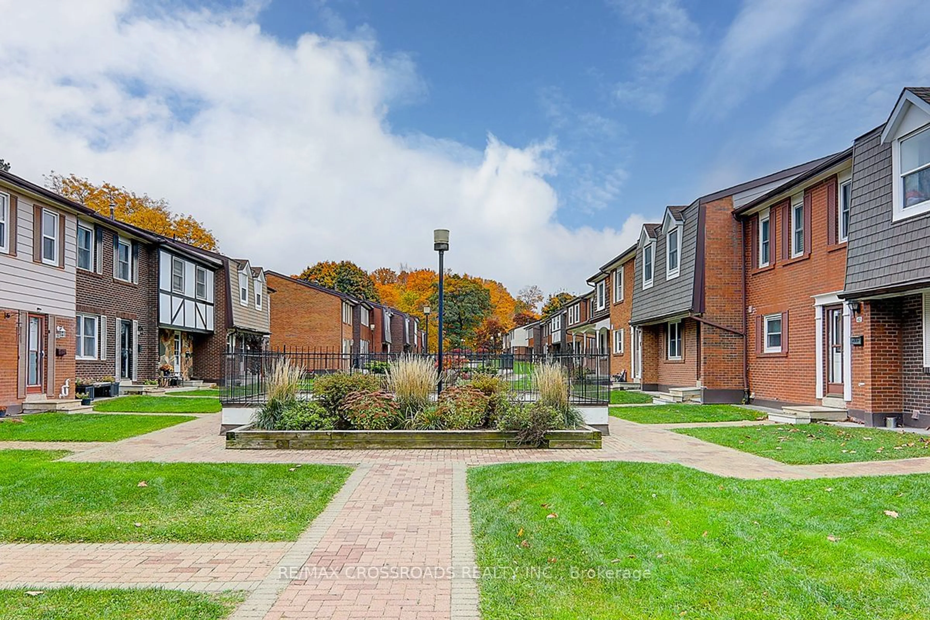 A pic from exterior of the house or condo, the street view for 15 Brimwood Blvd #32, Toronto Ontario M1V 1E1