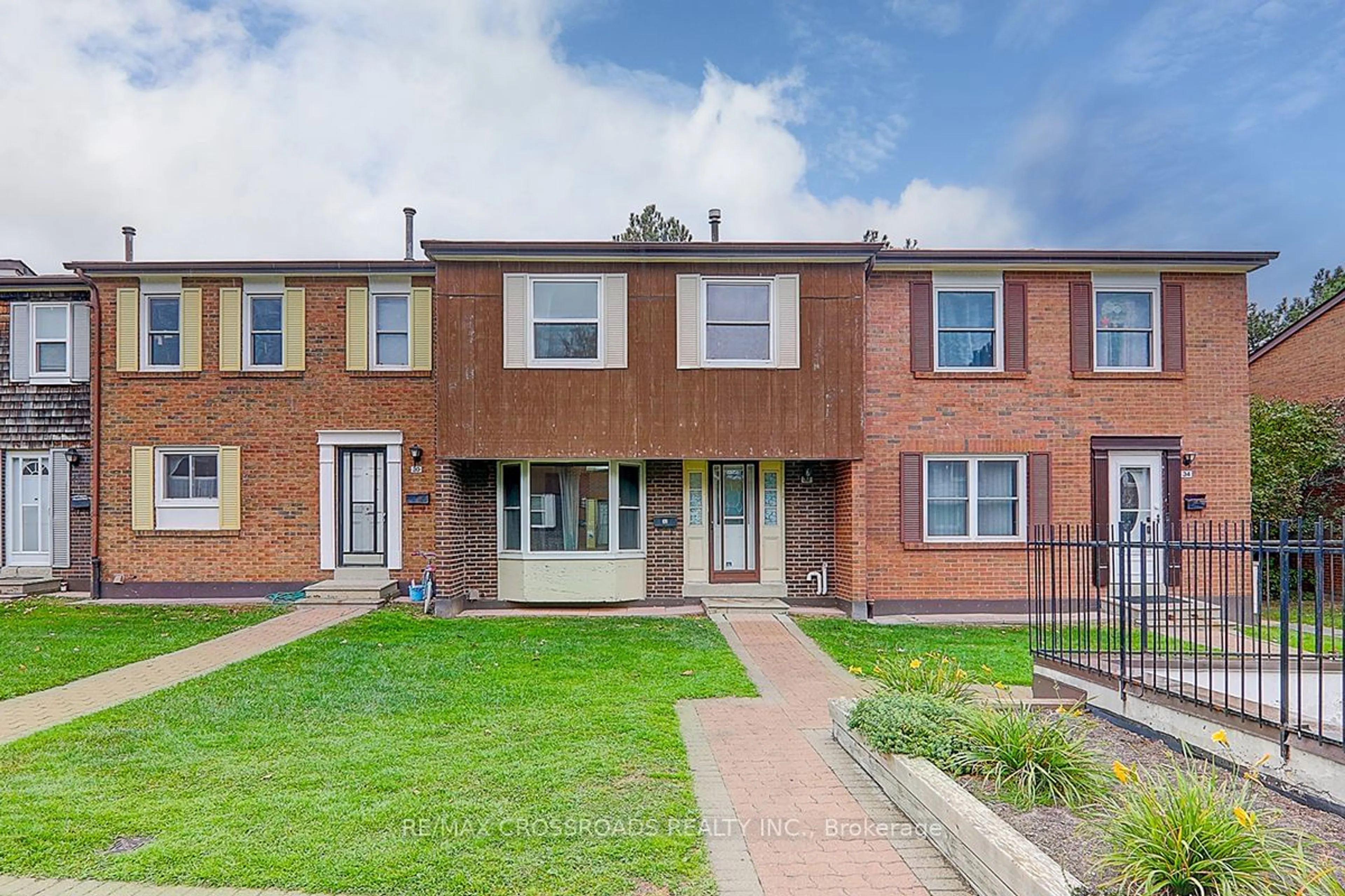 A pic from exterior of the house or condo, the street view for 15 Brimwood Blvd #32, Toronto Ontario M1V 1E1