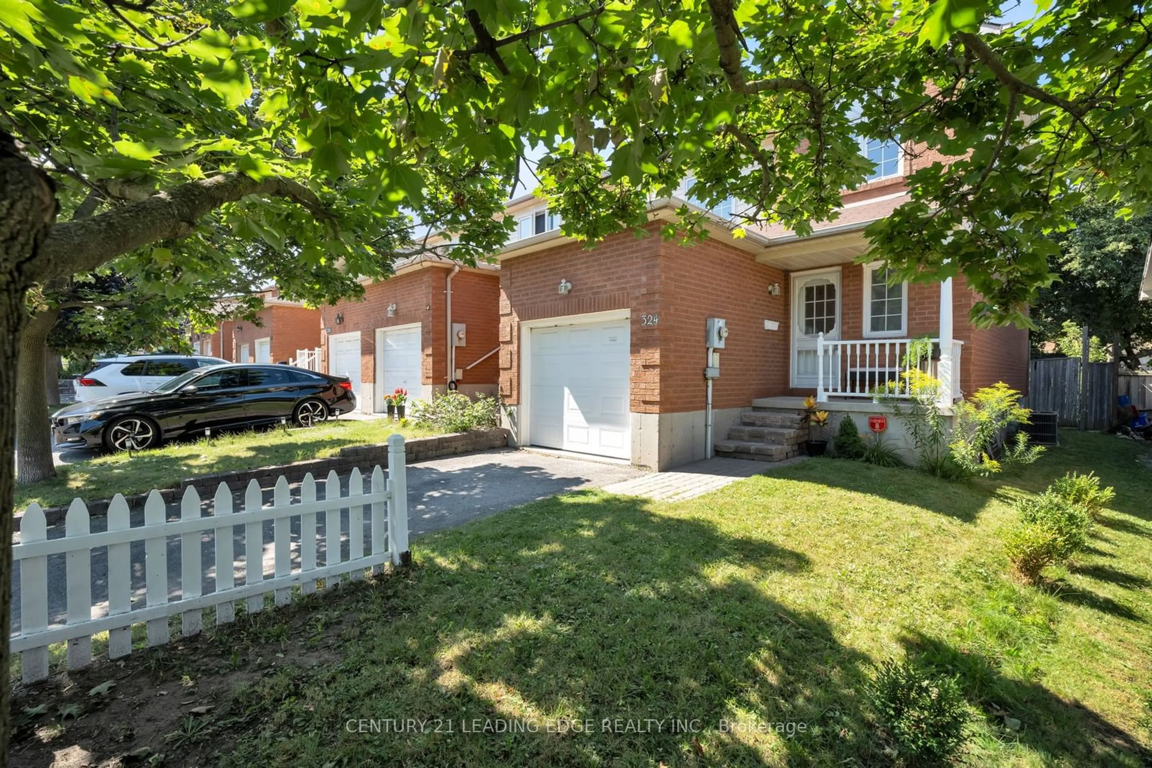 A pic from exterior of the house or condo, the fenced backyard for 324 Elgin St, Oshawa Ontario L1J 2P3