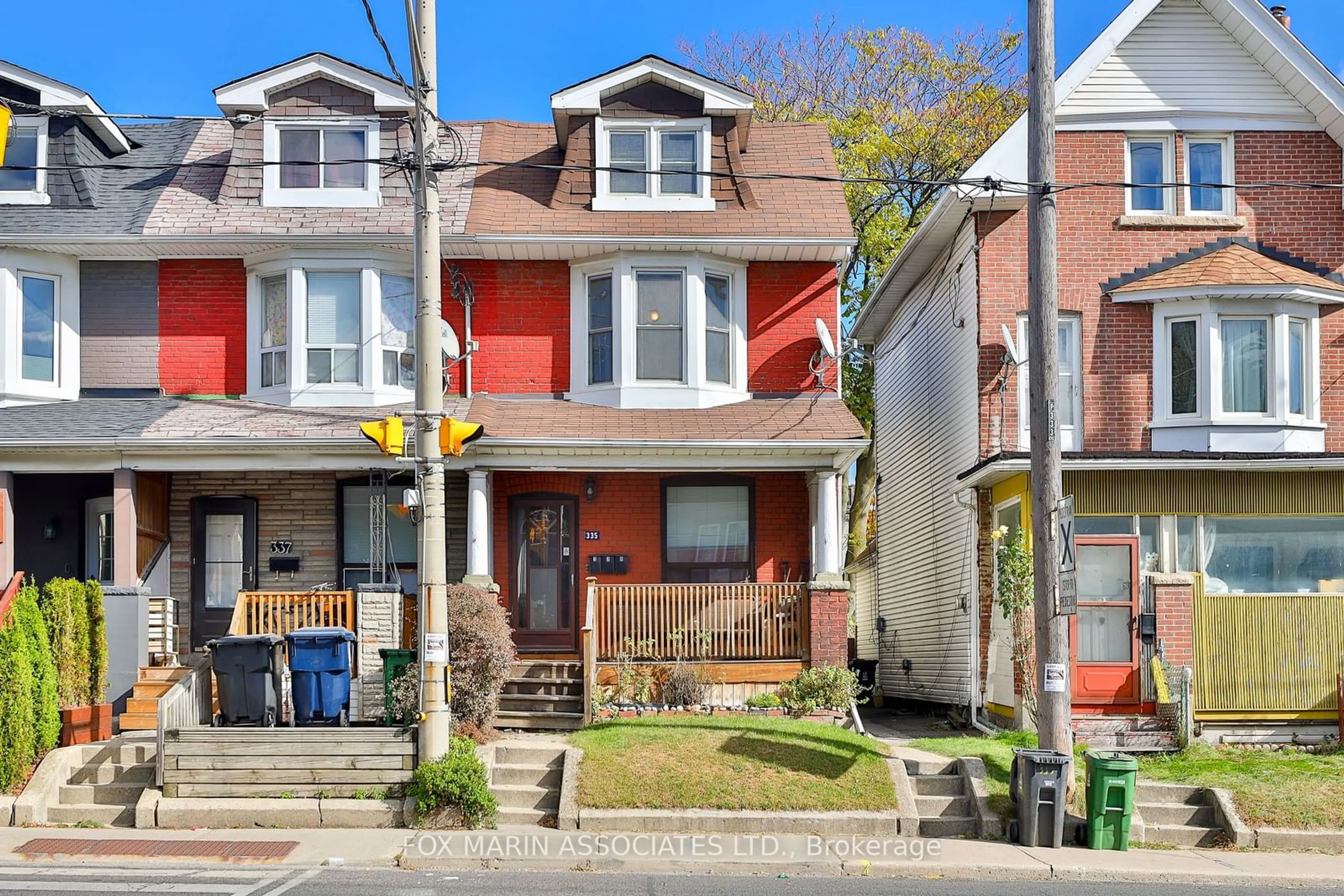 A pic from exterior of the house or condo, the street view for 335 Greenwood Ave, Toronto Ontario M4L 2R6