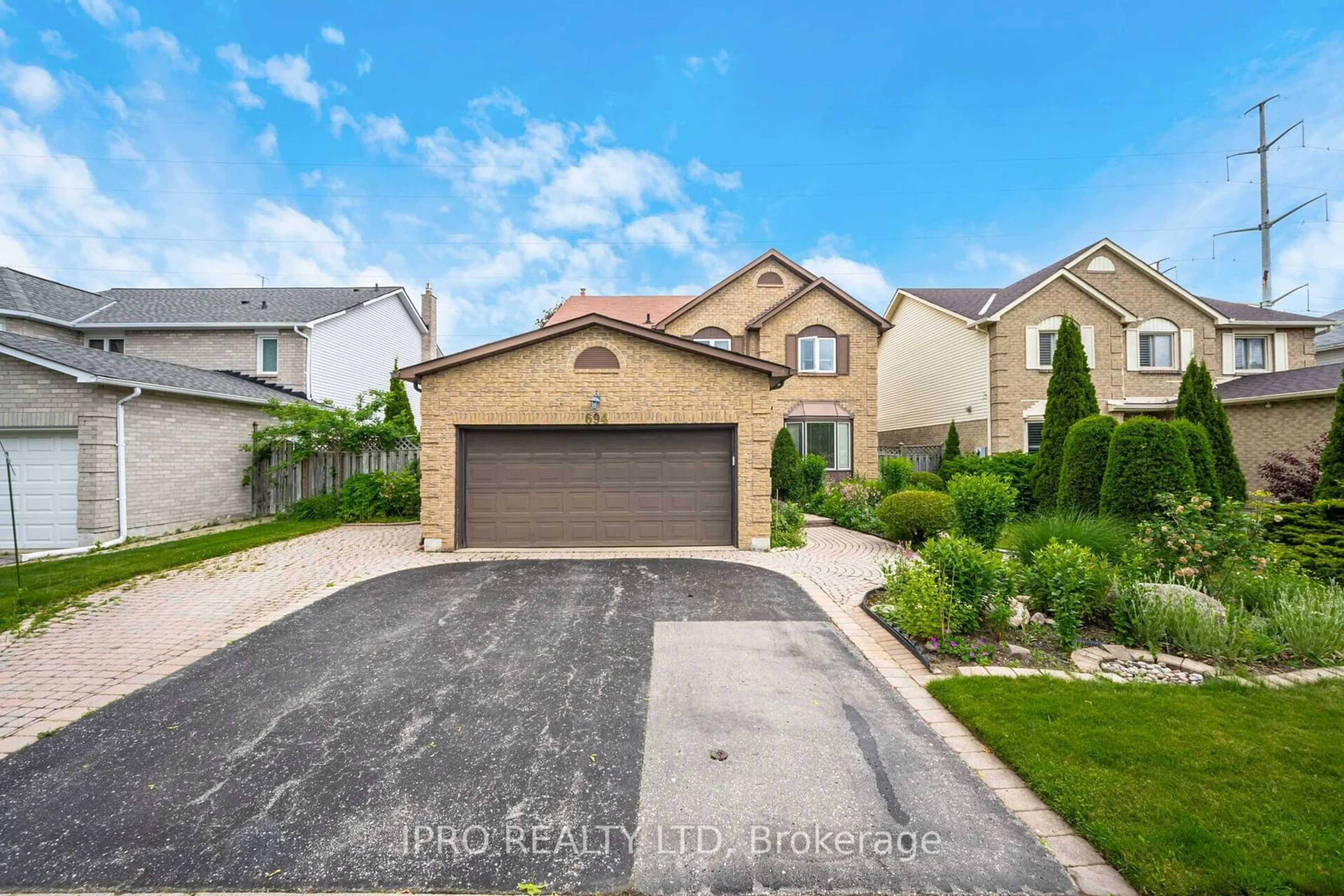 Frontside or backside of a home, the street view for 694 Amaretto Ave, Pickering Ontario L1X 1L6