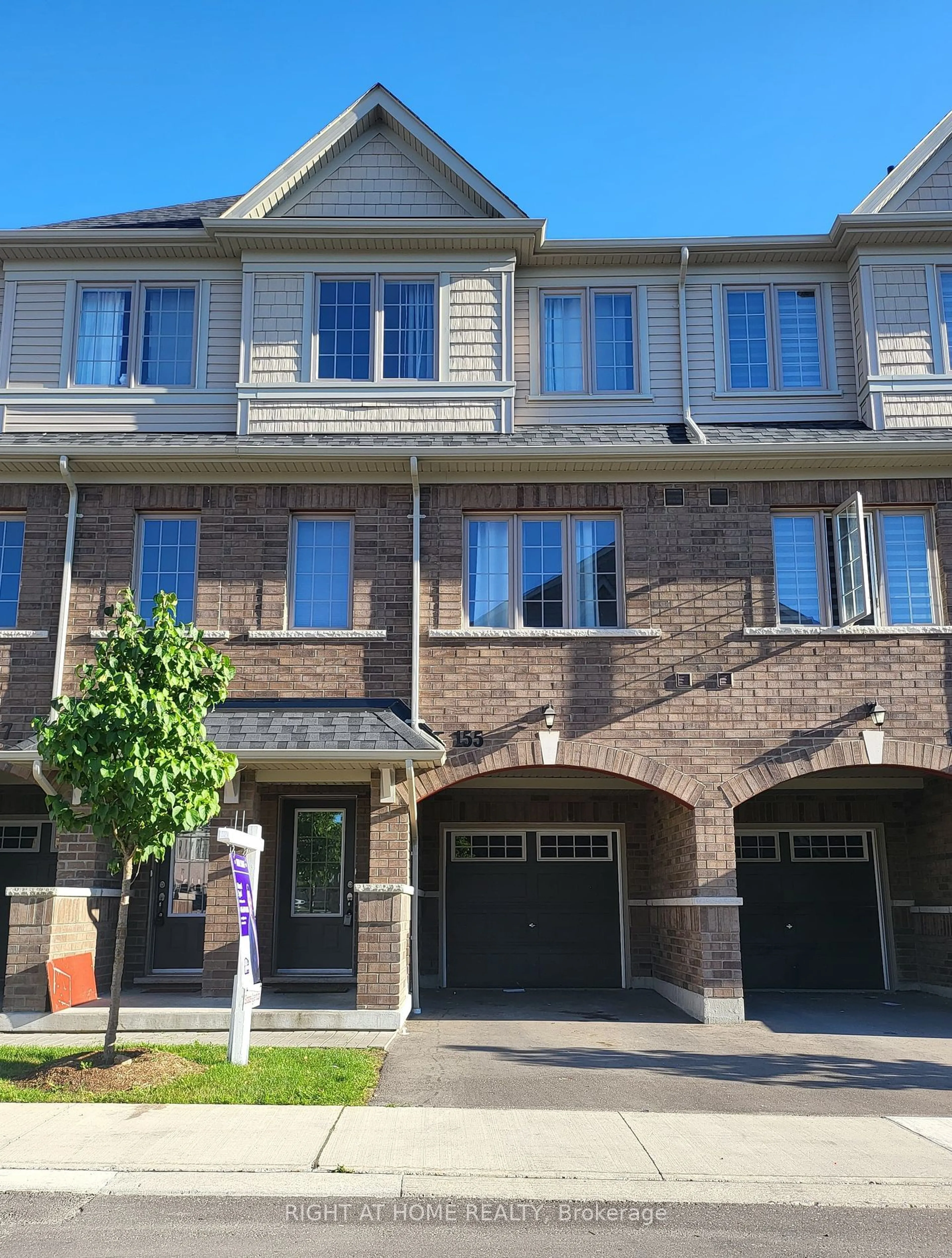 A pic from exterior of the house or condo, the street view for 155 Danzatore Path #63, Oshawa Ontario L1L 0P9