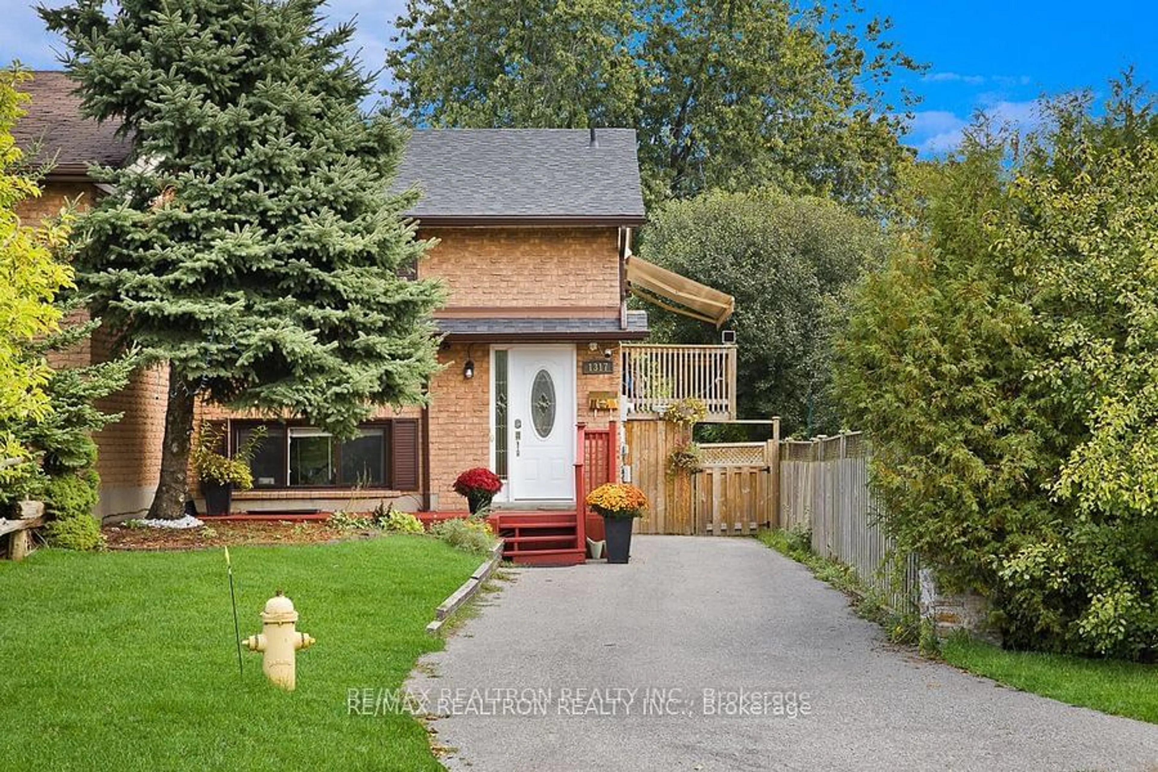 Frontside or backside of a home, the fenced backyard for 1317 Fundy Crt, Oshawa Ontario L1J 3N5