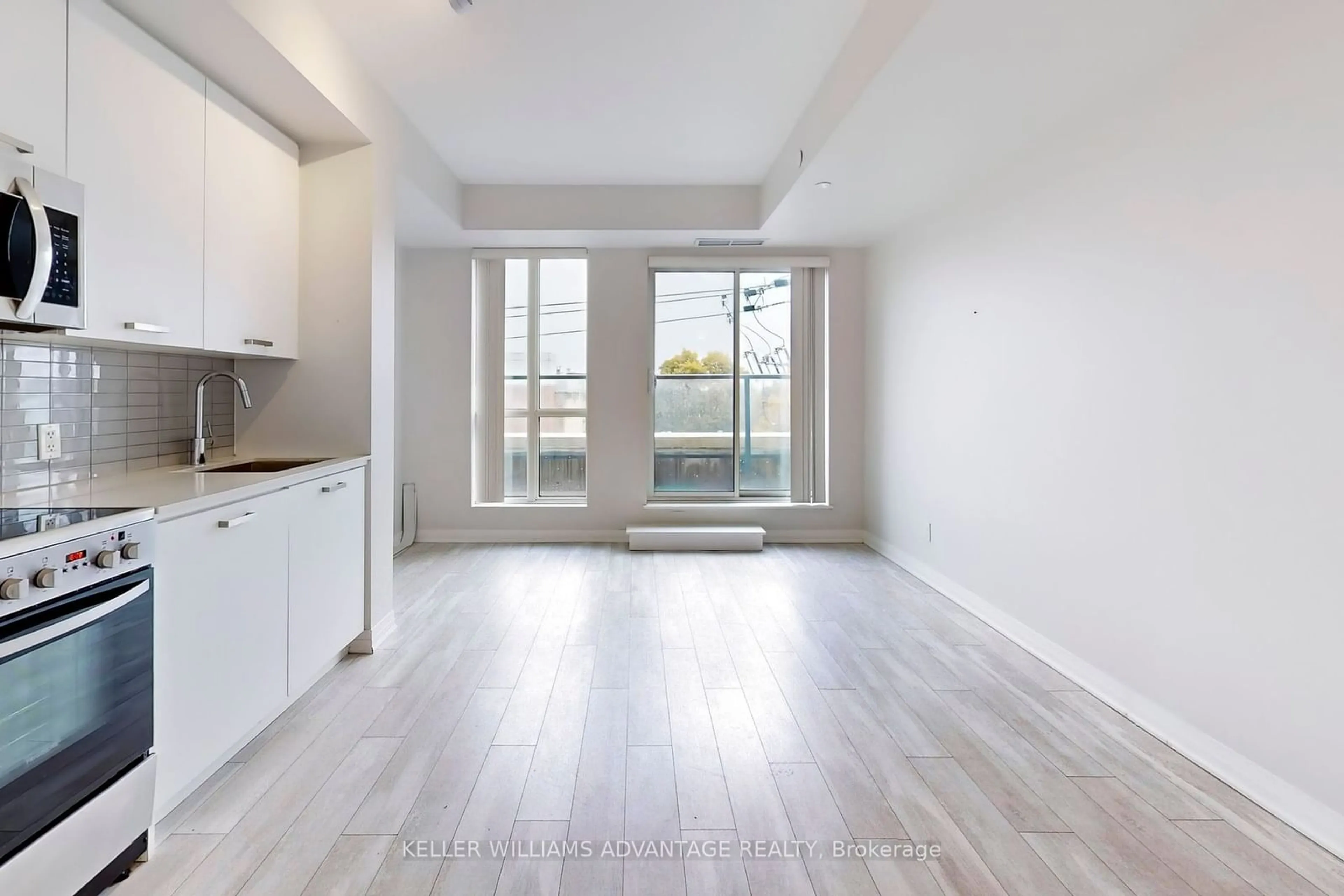 A pic of a room, wood floors for 1630 Queen St #406, Toronto Ontario M4L 0B3