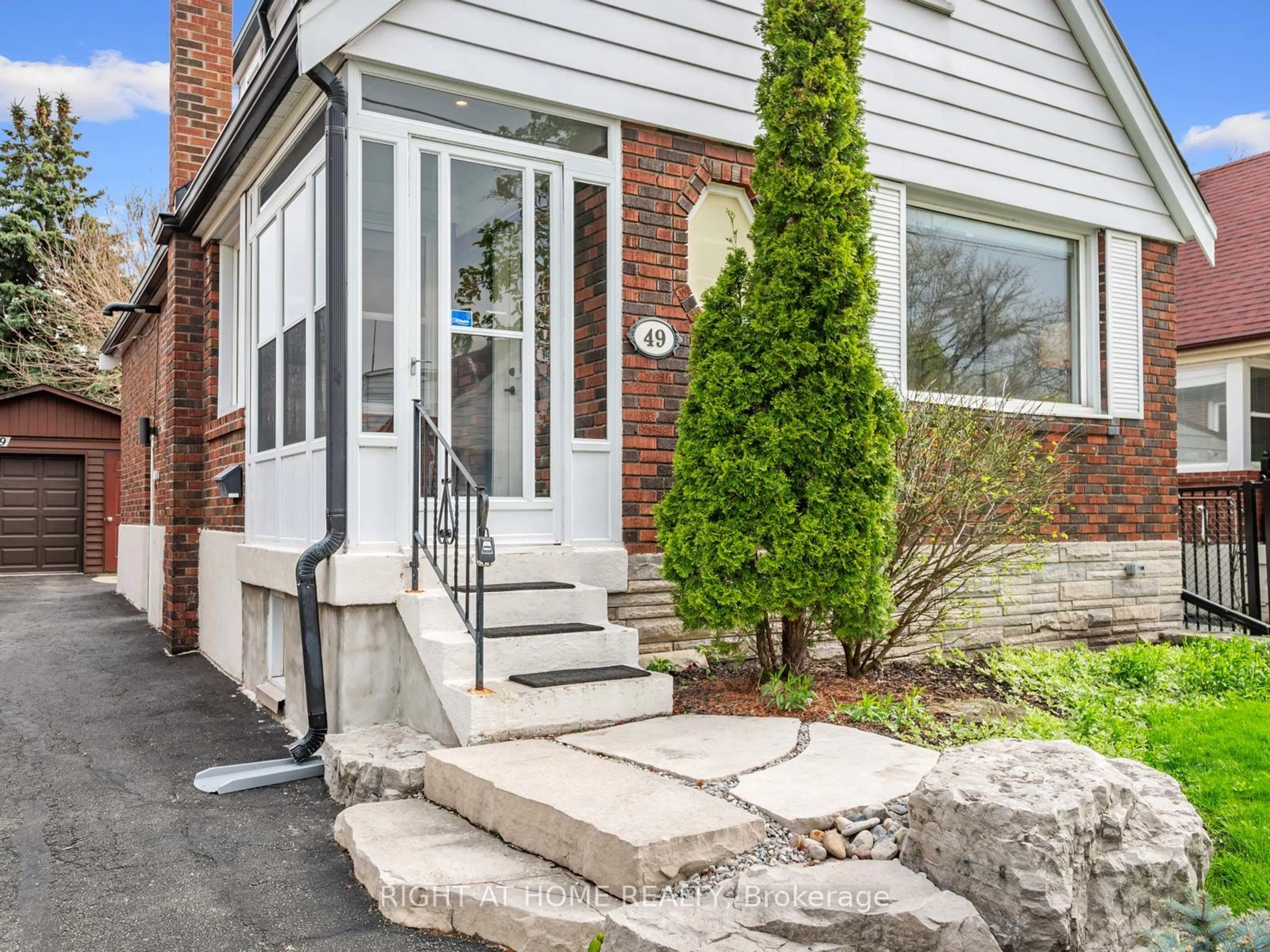 Home with brick exterior material for 49 Amsterdam Ave, Toronto Ontario M4B 2B9