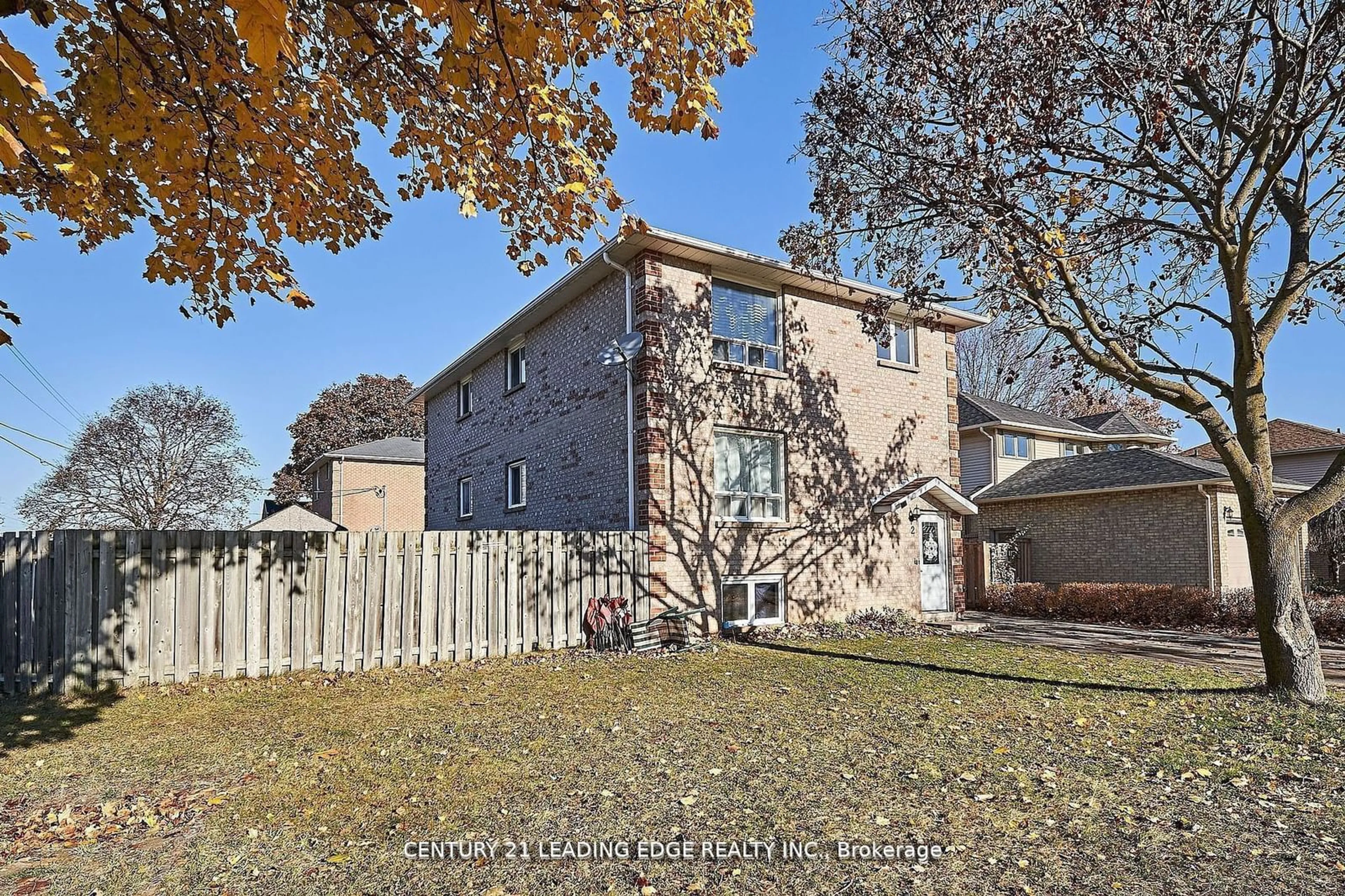 A pic from exterior of the house or condo, the fenced backyard for 2 Kingsway Gate, Clarington Ontario N8M 3C2