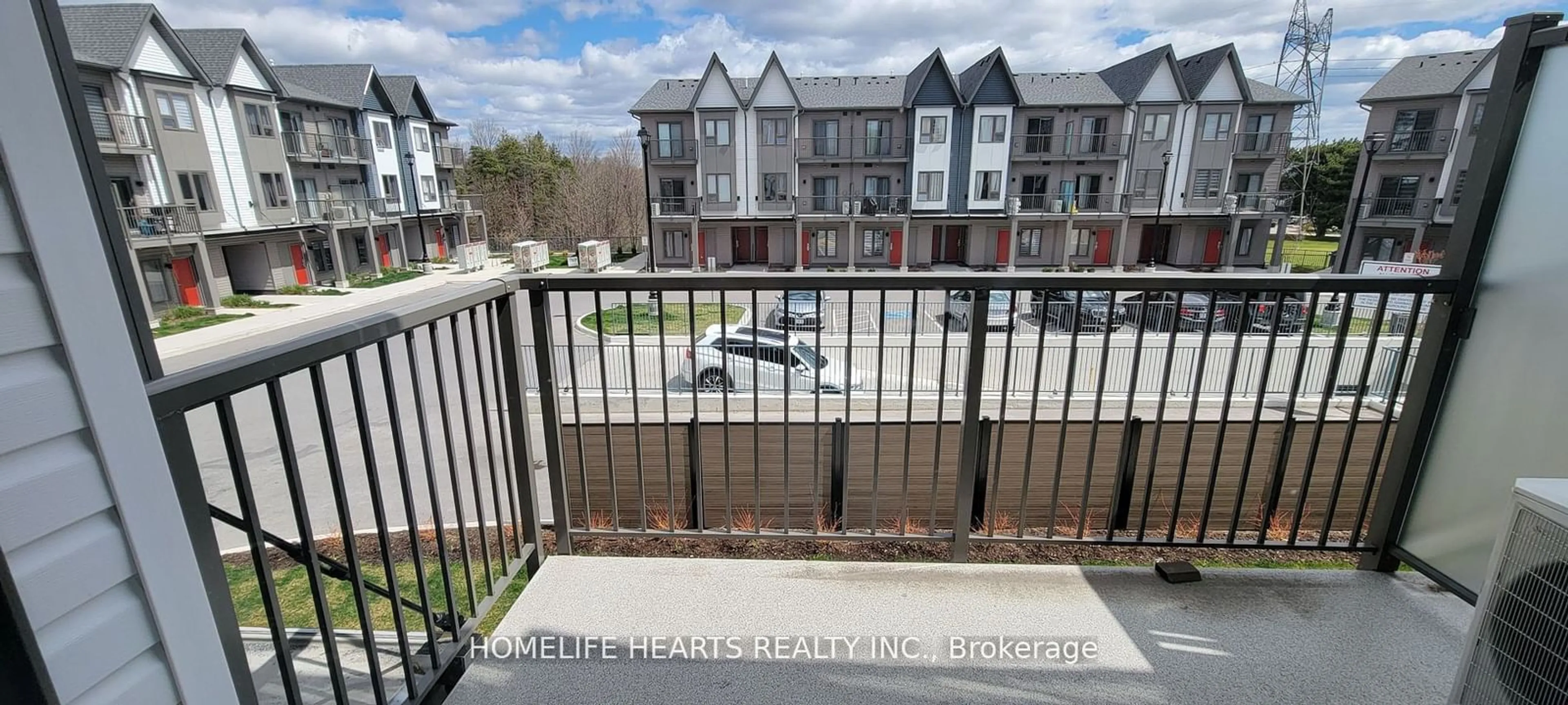 A pic from exterior of the house or condo, the fenced backyard for 2635 William Jackson Dr #209, Pickering Ontario L1X 0L3