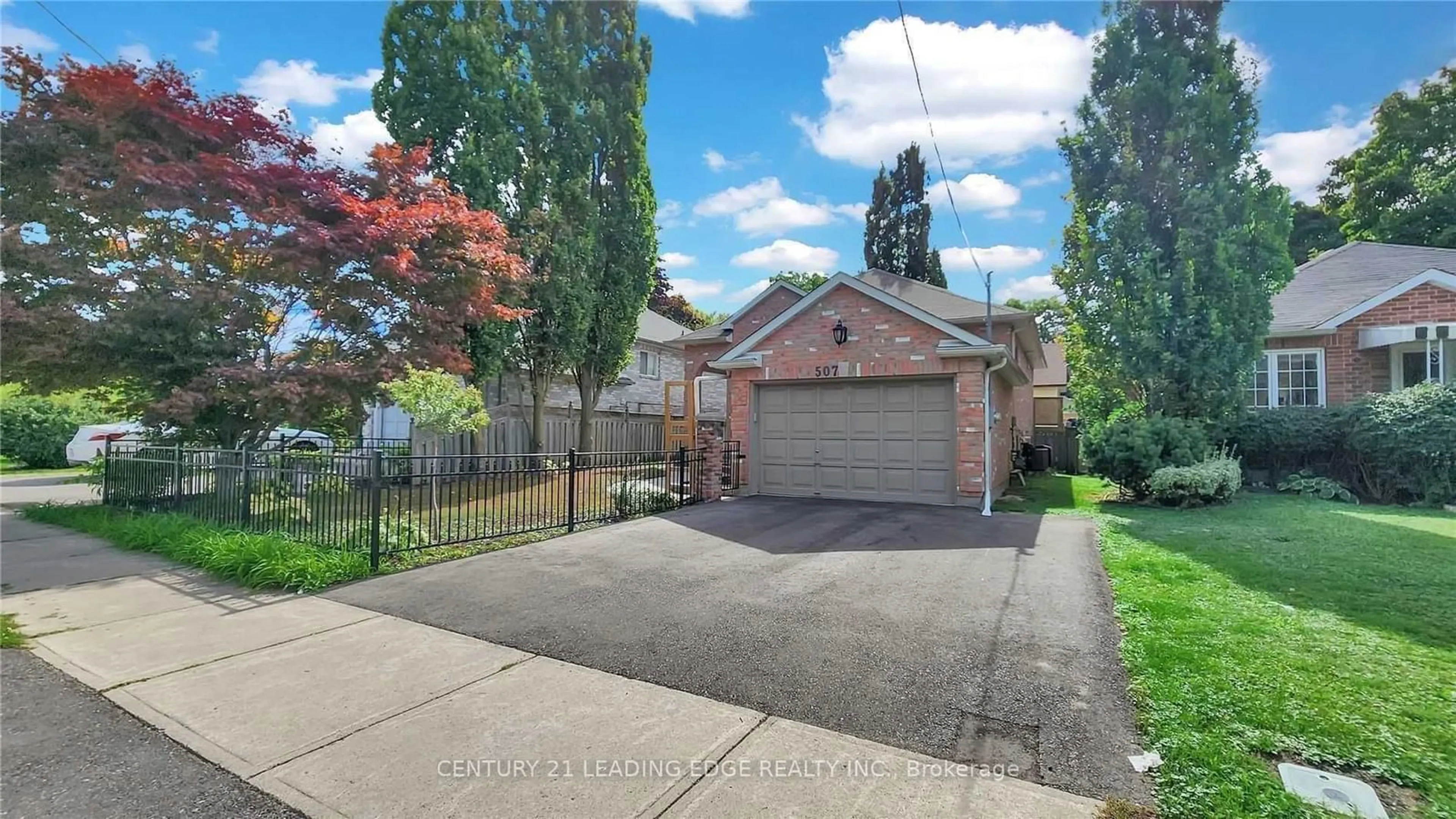 Frontside or backside of a home, the fenced backyard for 507 Dunlop St, Whitby Ontario L1N 1V3