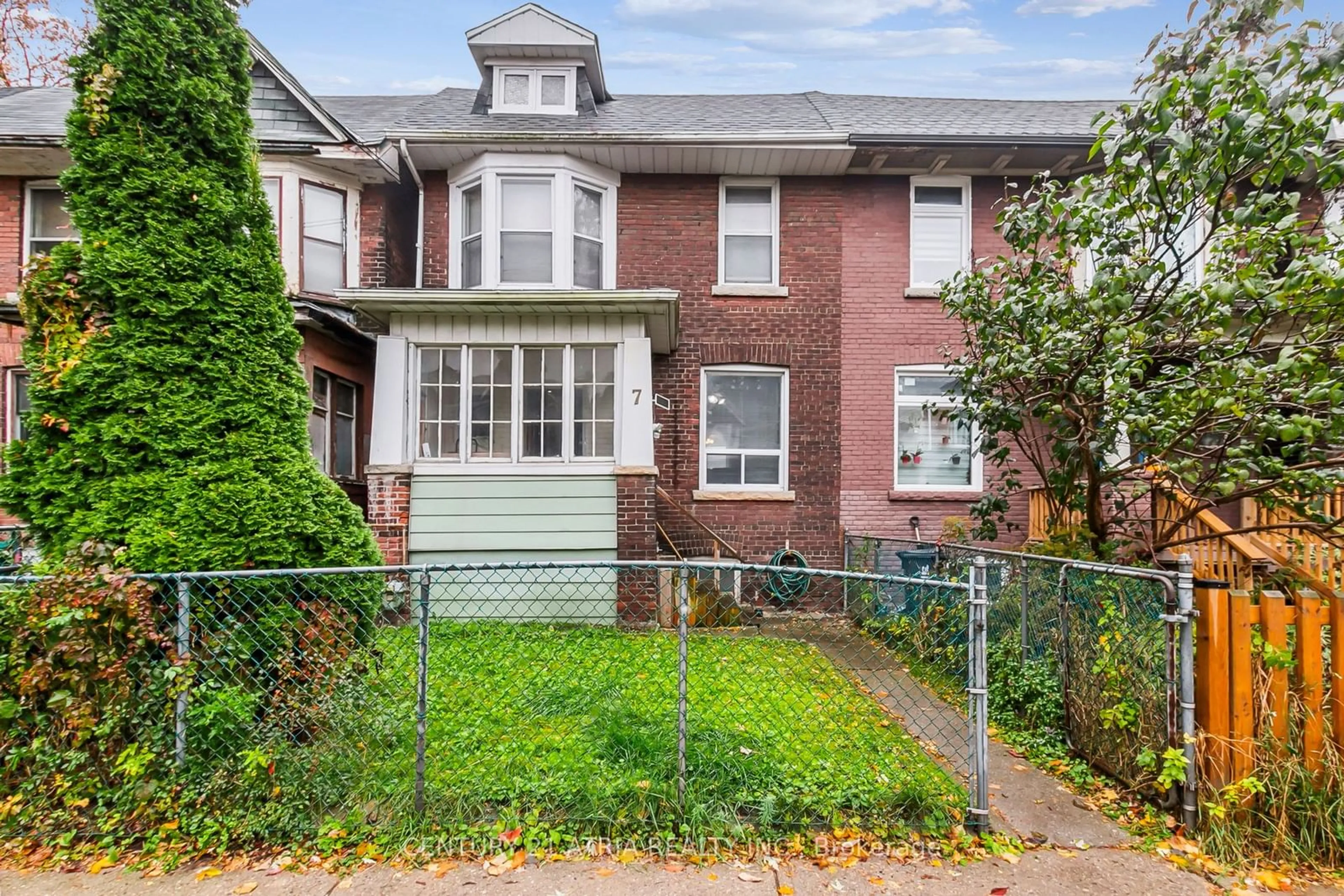 Frontside or backside of a home, the fenced backyard for 7 Cherry Nook Gdns, Toronto Ontario M4L 1J5