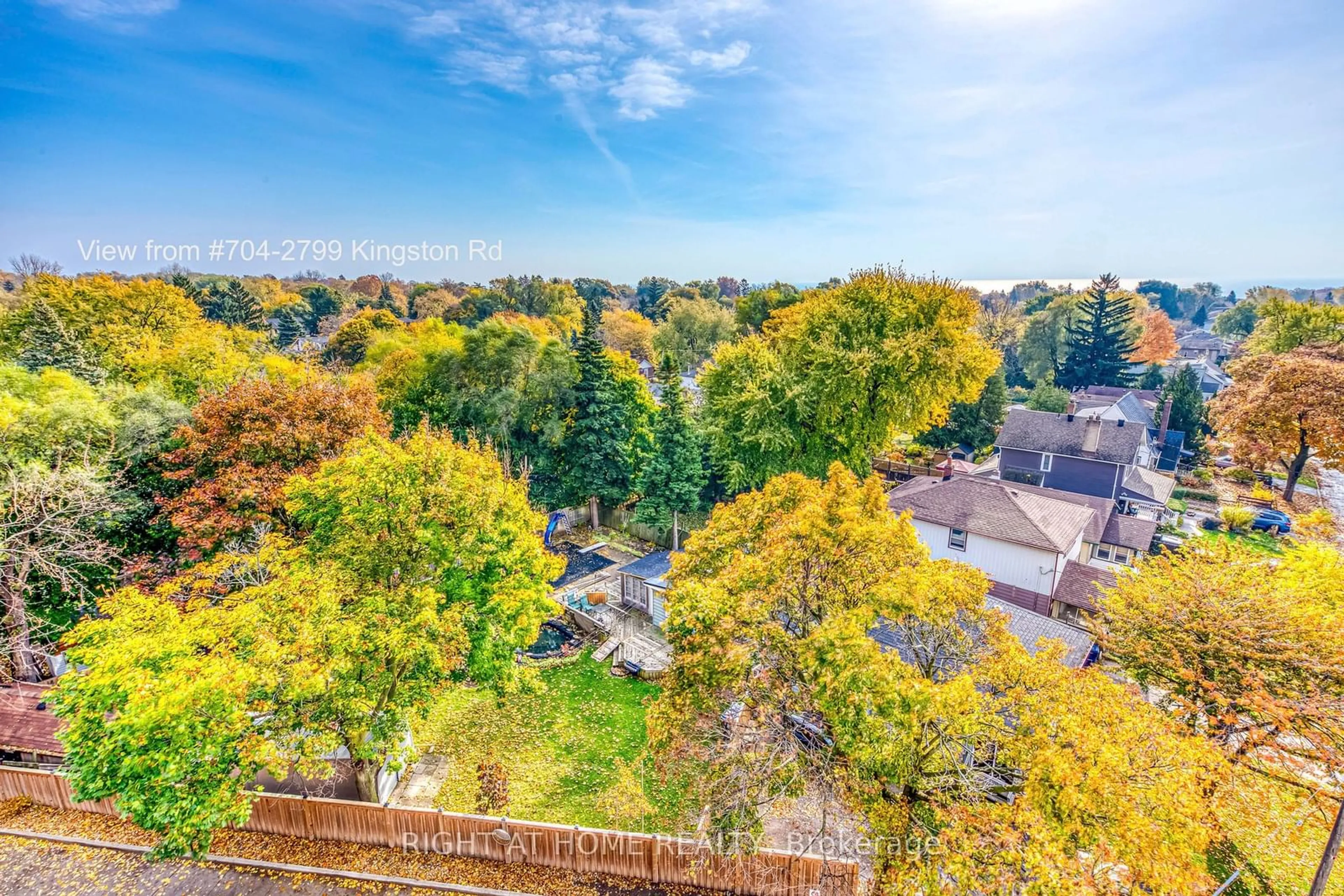 A pic from exterior of the house or condo, the fenced backyard for 2799 Kingston Rd #704, Toronto Ontario M1M 0E3