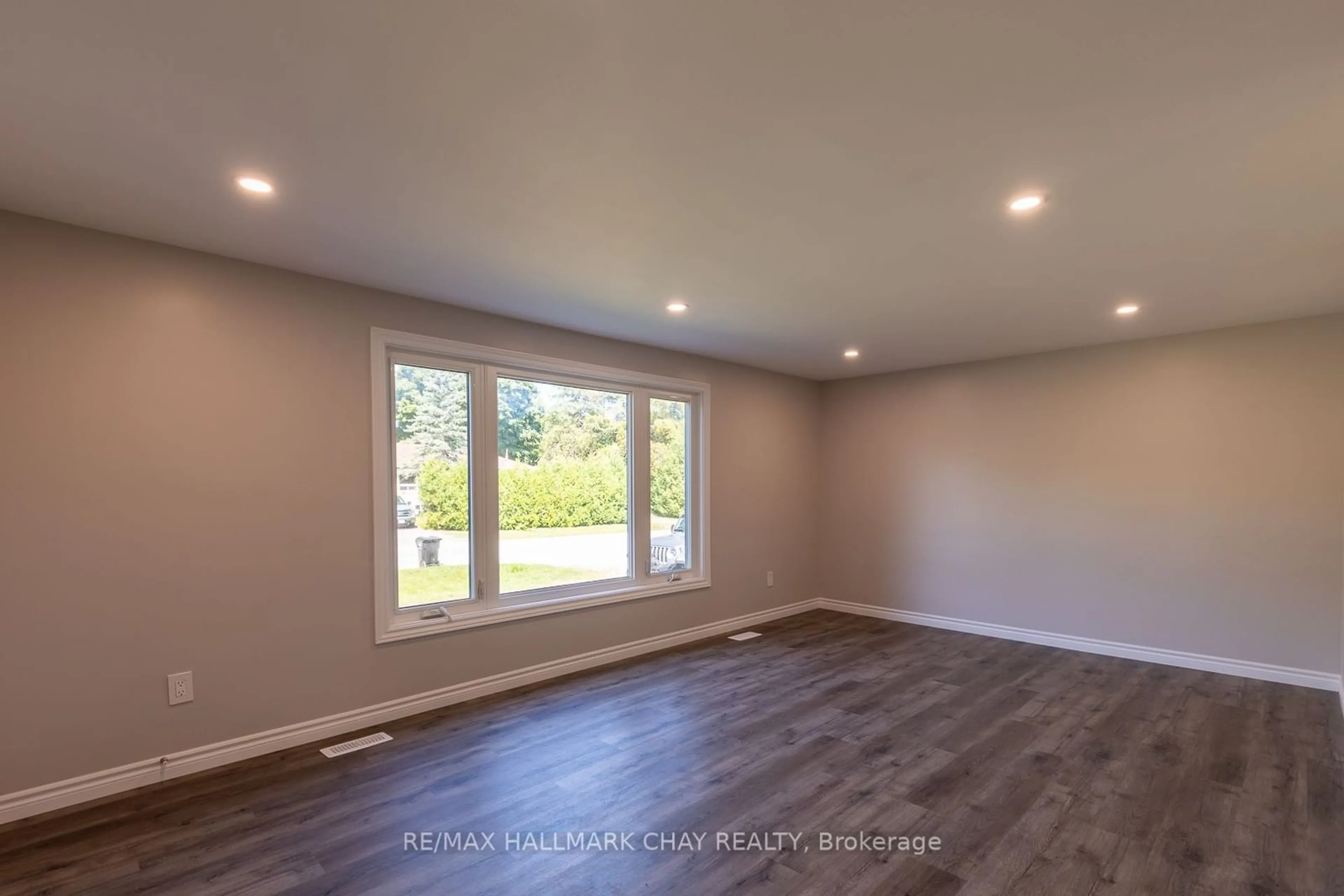 A pic of a room, wood floors for 230B Cindy Lane, Essa Ontario L0M 1B0