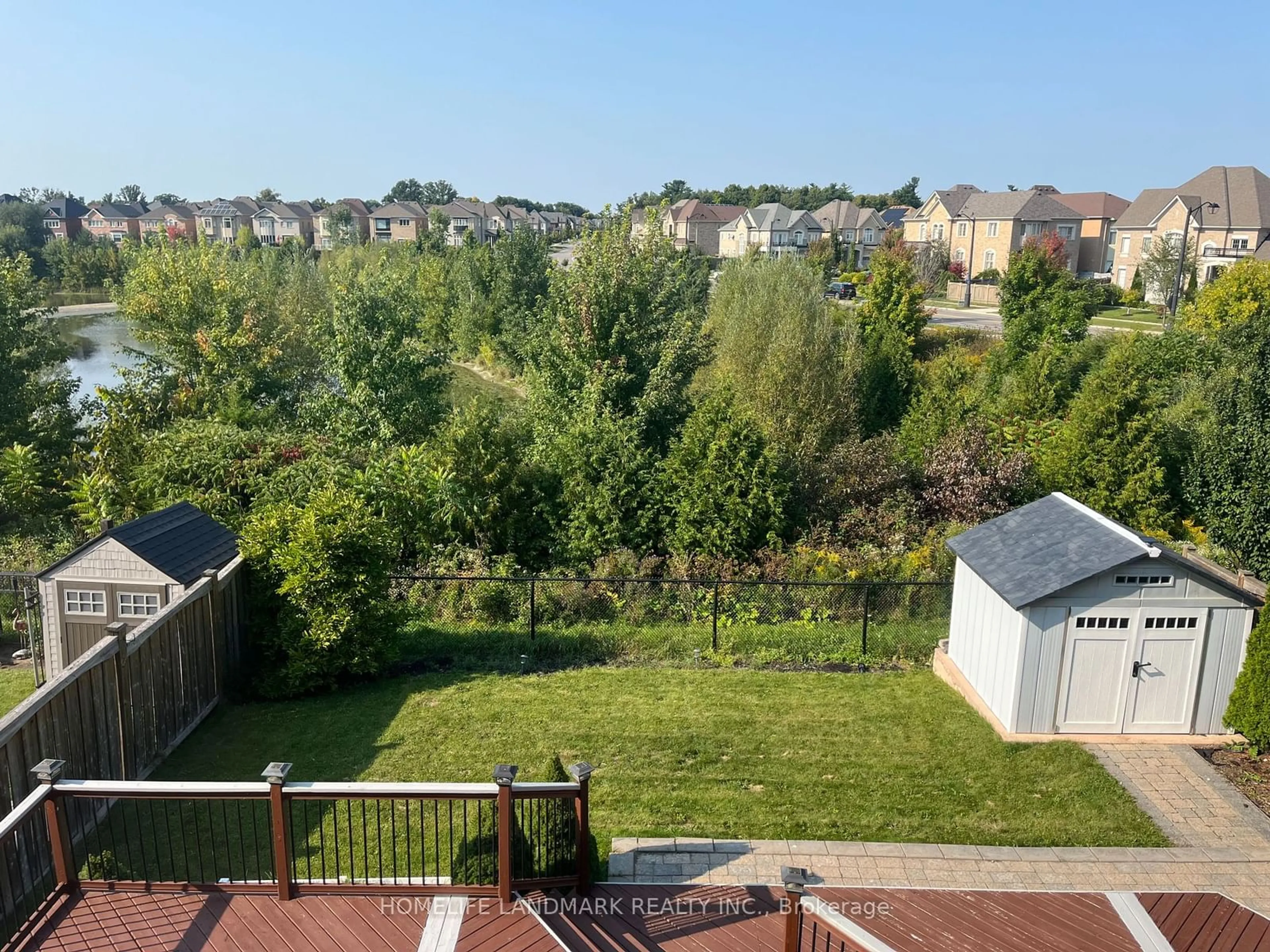 Frontside or backside of a home, the fenced backyard for 16 Hailsham Crt, Vaughan Ontario L4H 3N8