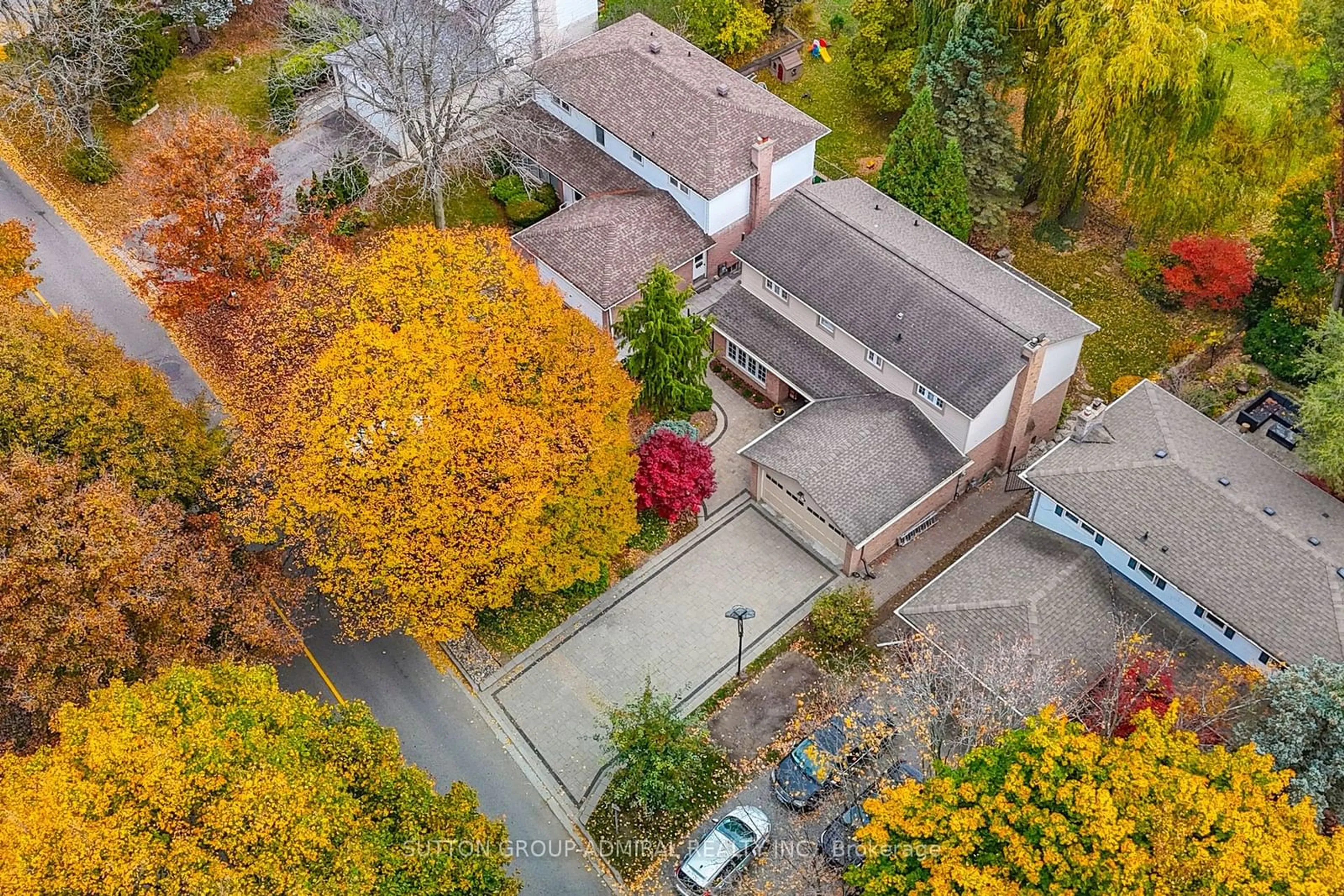 A pic from exterior of the house or condo, the fenced backyard for 91 Kirk Dr, Markham Ontario L3T 3K8