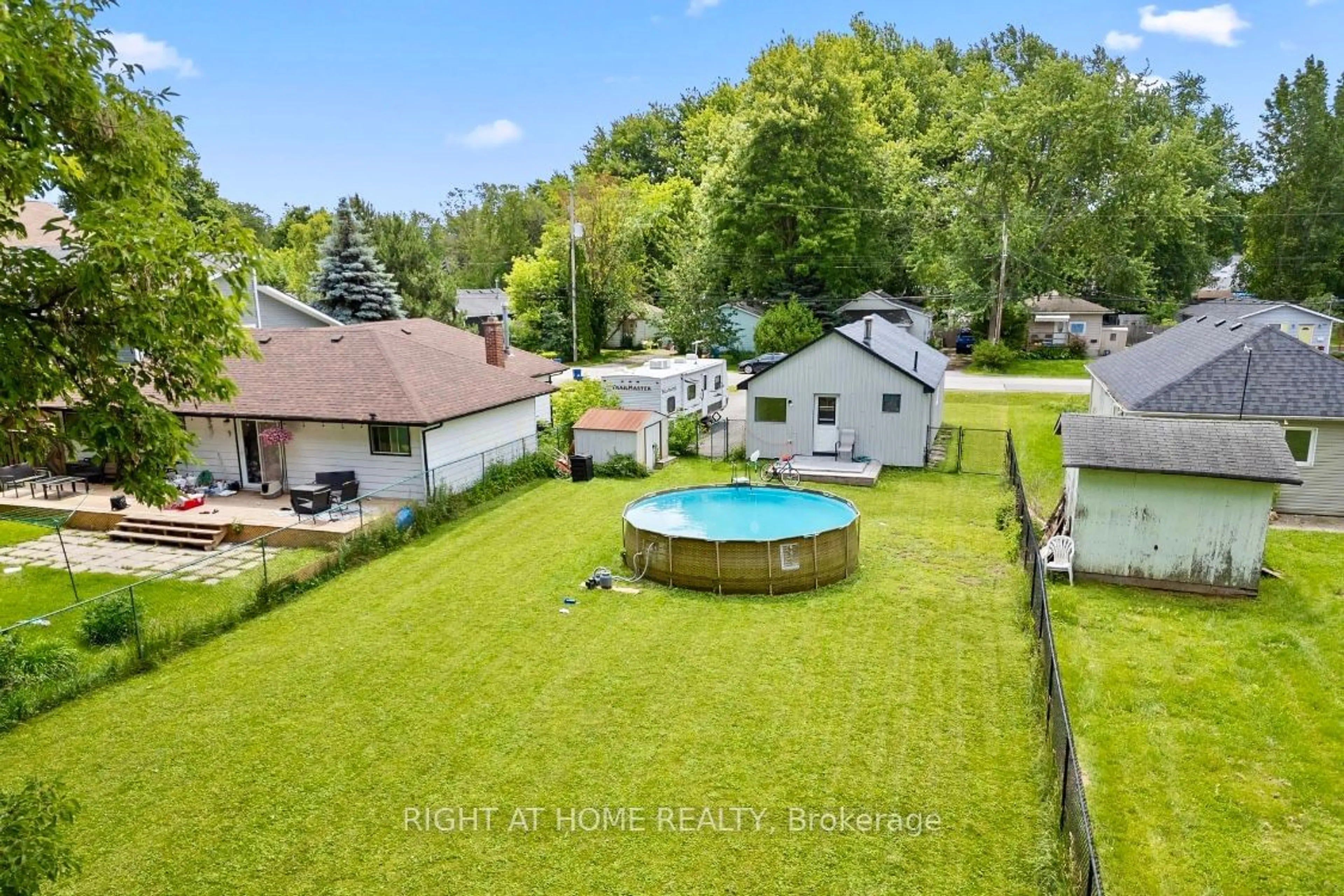 Frontside or backside of a home, the fenced backyard for 208 Bayview Ave, Georgina Ontario L4P 2T2