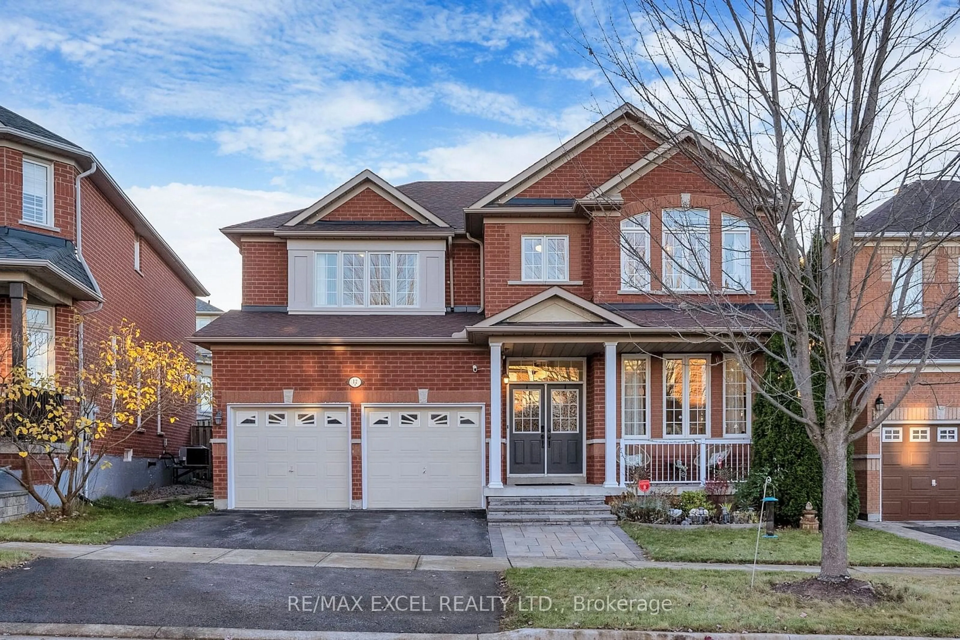 Home with brick exterior material for 12 Thornwood Chase Rd, Markham Ontario L6E 1Y1