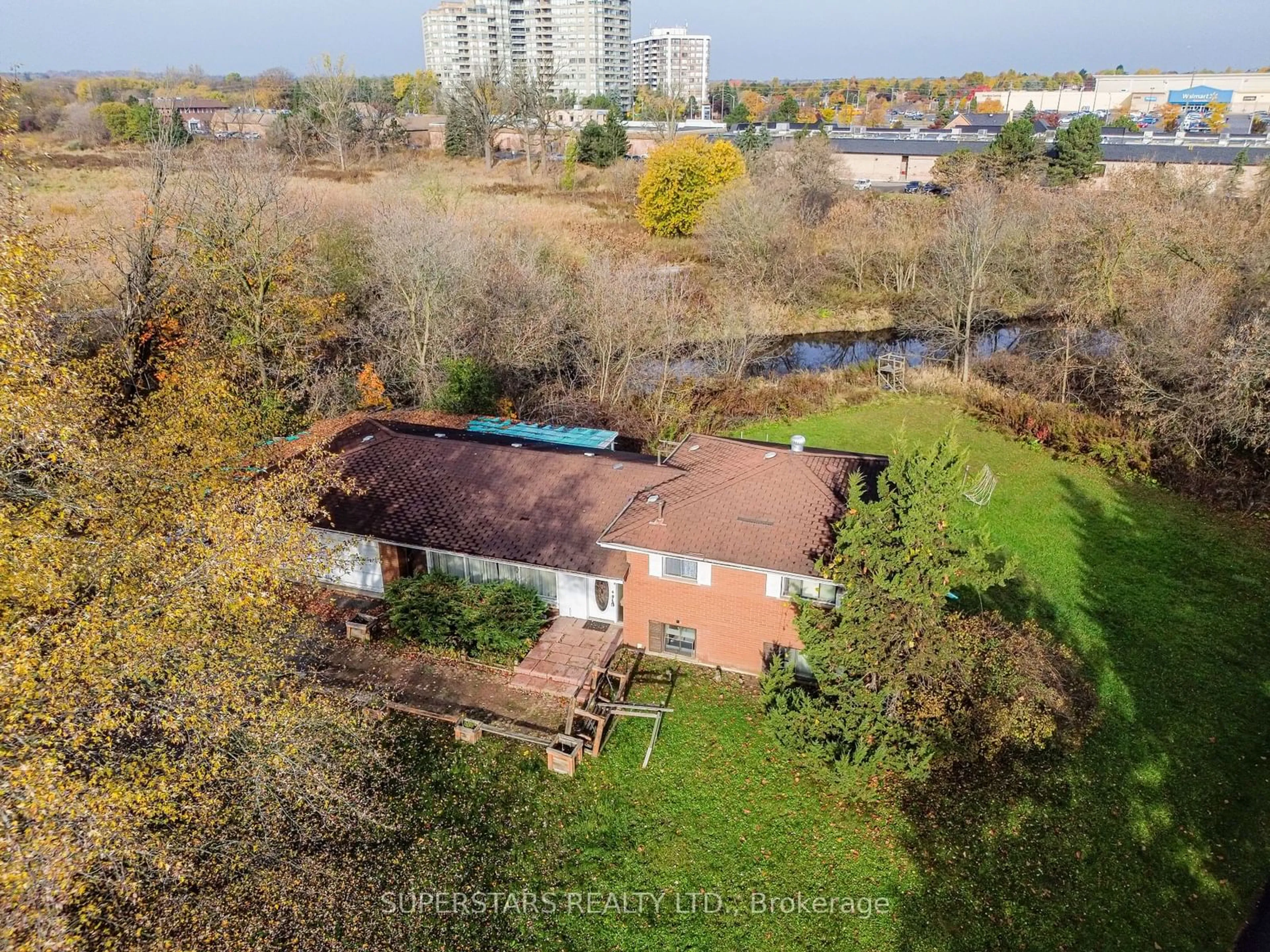 A pic from exterior of the house or condo, the fenced backyard for 12 Campbell Crt, Markham Ontario L3R 2B4