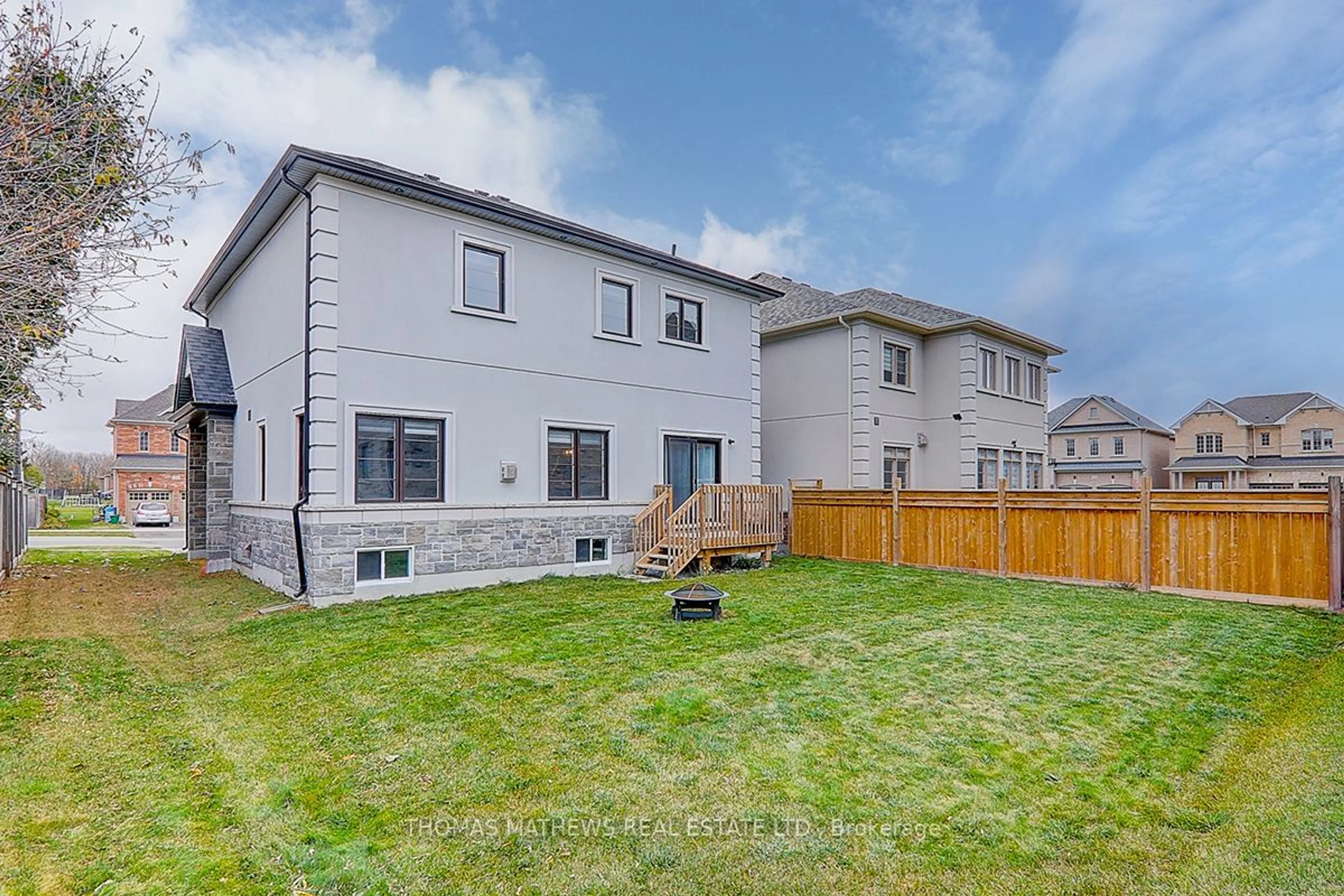 Frontside or backside of a home, the fenced backyard for 11 Glen Rye St, Georgina Ontario L4P 0J8