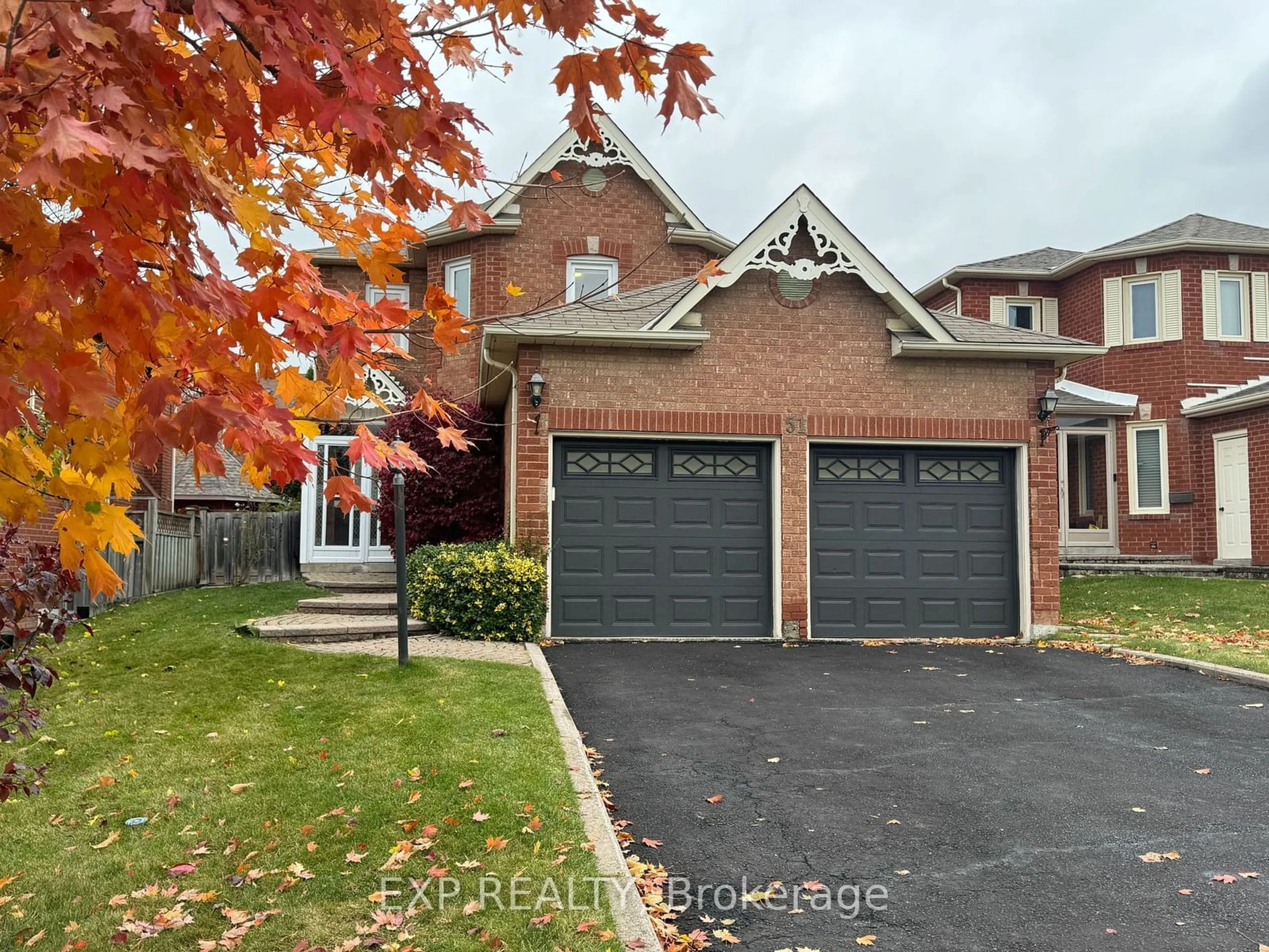 Frontside or backside of a home, the street view for 51 Militia Tr, Markham Ontario L3R 9H7