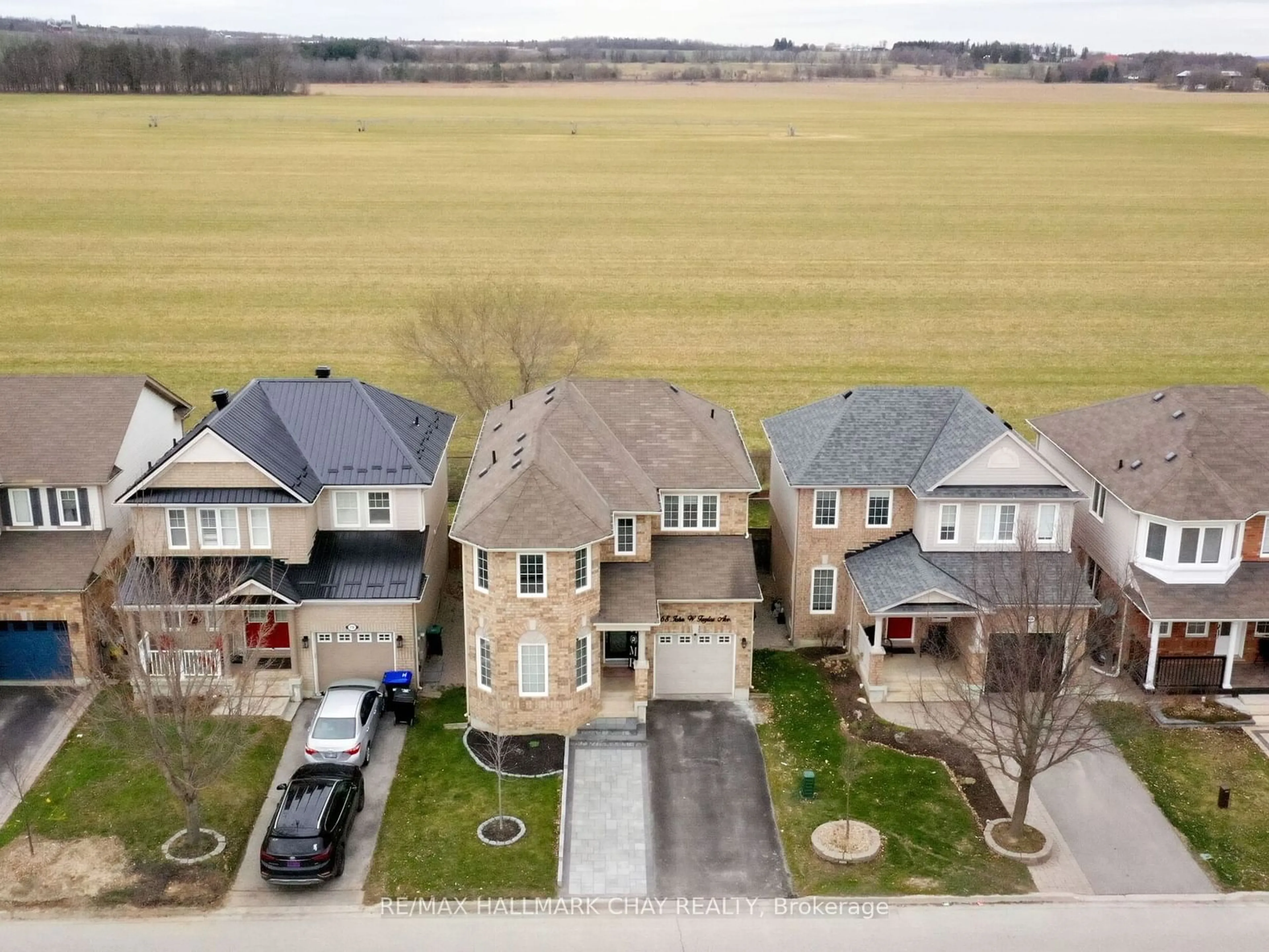 Frontside or backside of a home, the street view for 68 John W Taylor Ave, New Tecumseth Ontario L9R 0B5