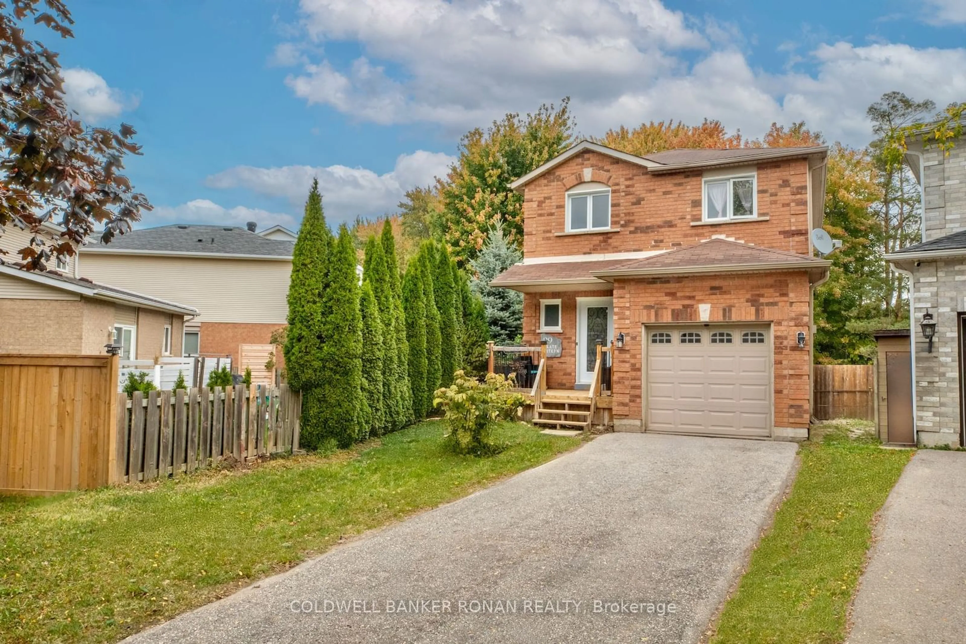 Frontside or backside of a home, the fenced backyard for 99 Kate Aitken Cres, New Tecumseth Ontario L0G 1A0