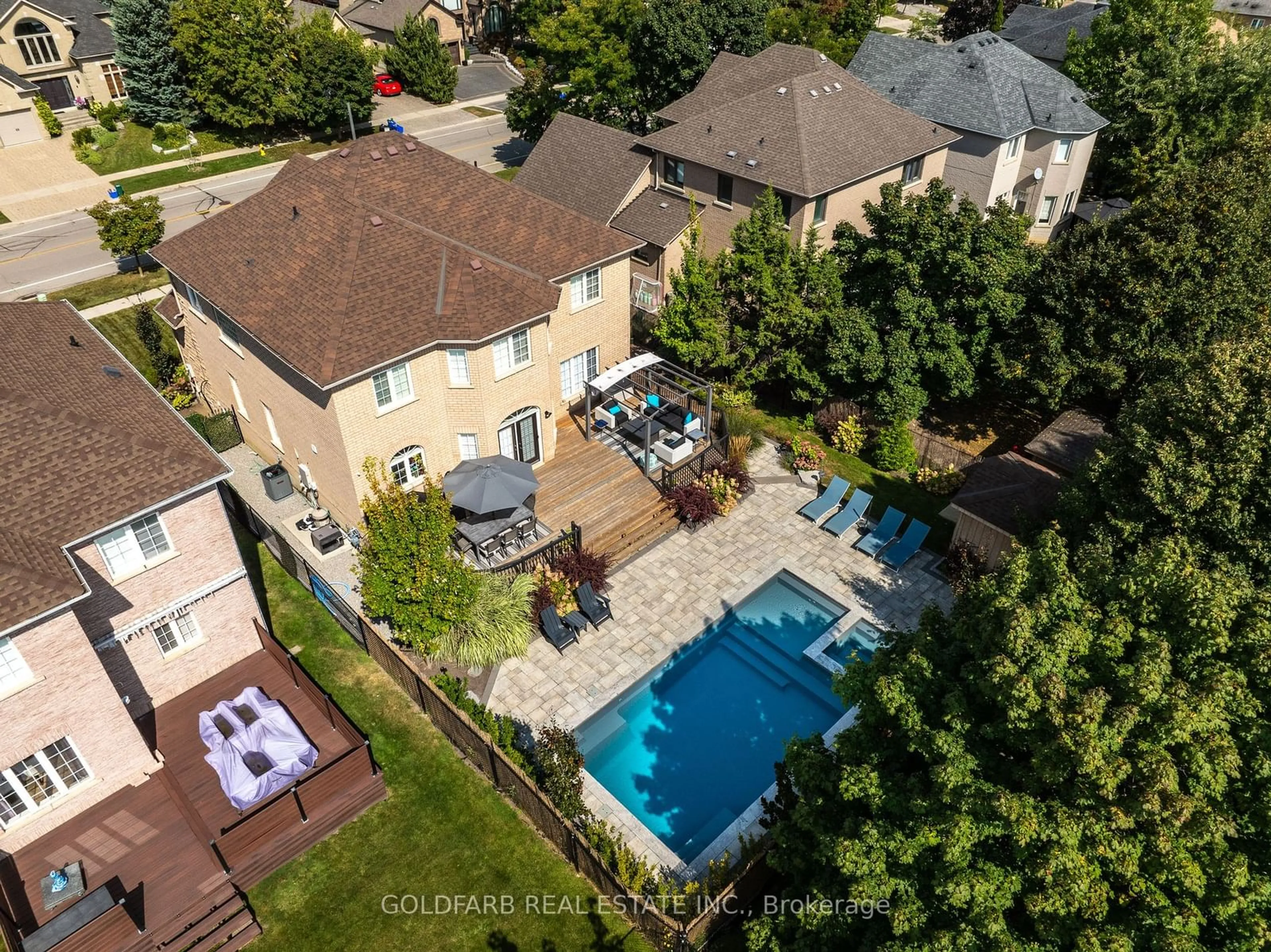 Frontside or backside of a home, the fenced backyard for 215 Thomson Creek Blvd, Vaughan Ontario L4H 1H1