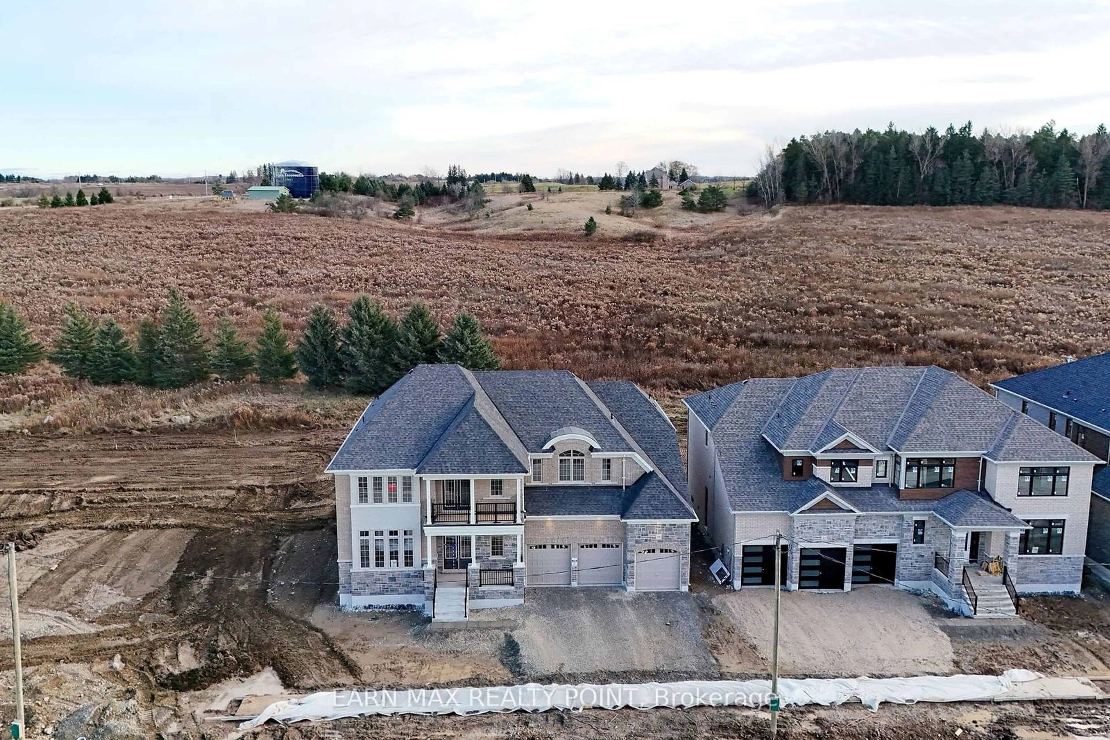 A pic from exterior of the house or condo, the fenced backyard for 19 Marigold Blvd, Adjala-Tosorontio Ontario L0G 1W0