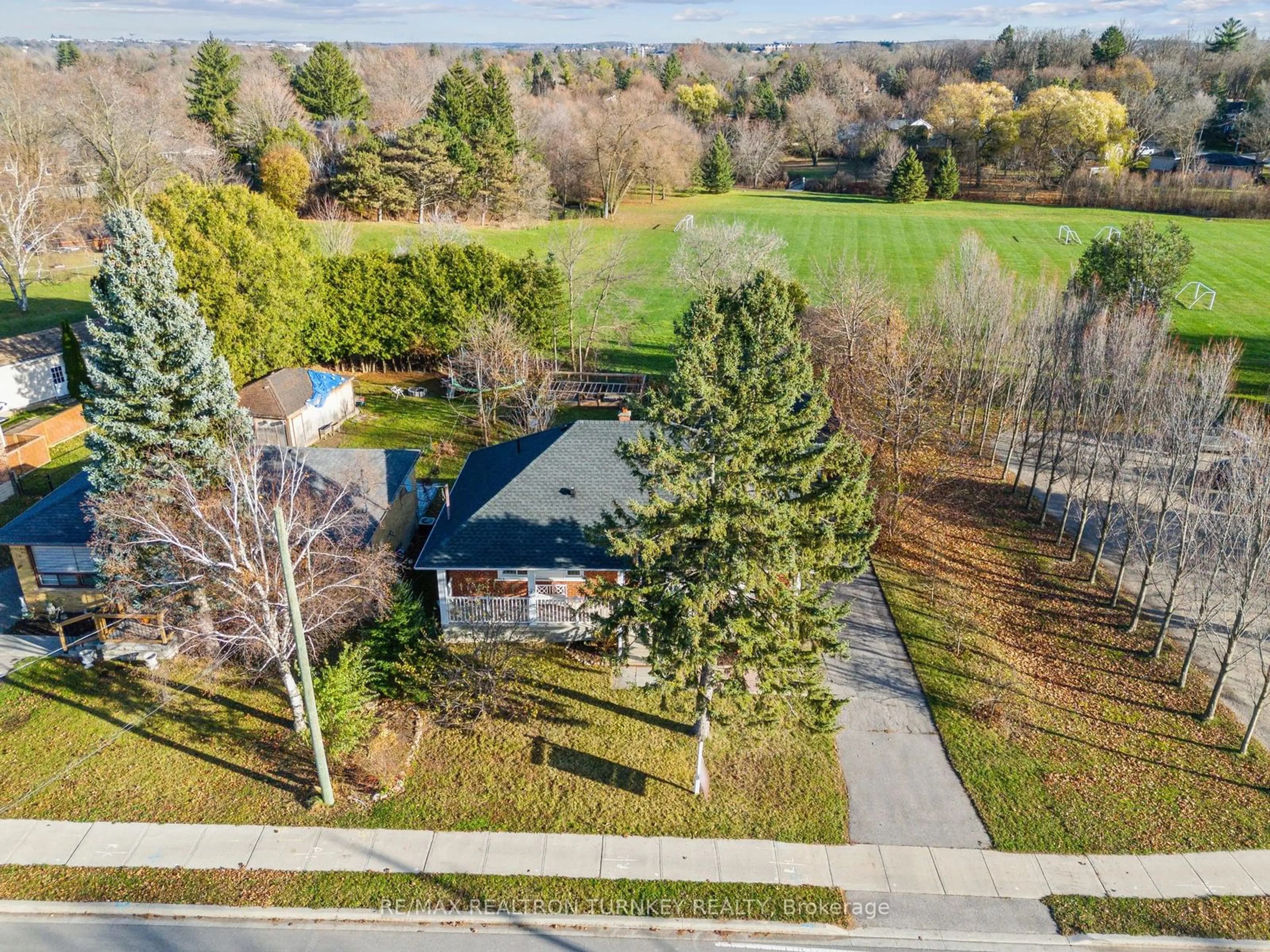 Frontside or backside of a home, the fenced backyard for 128 Queen St, Newmarket Ontario L3Y 2E8