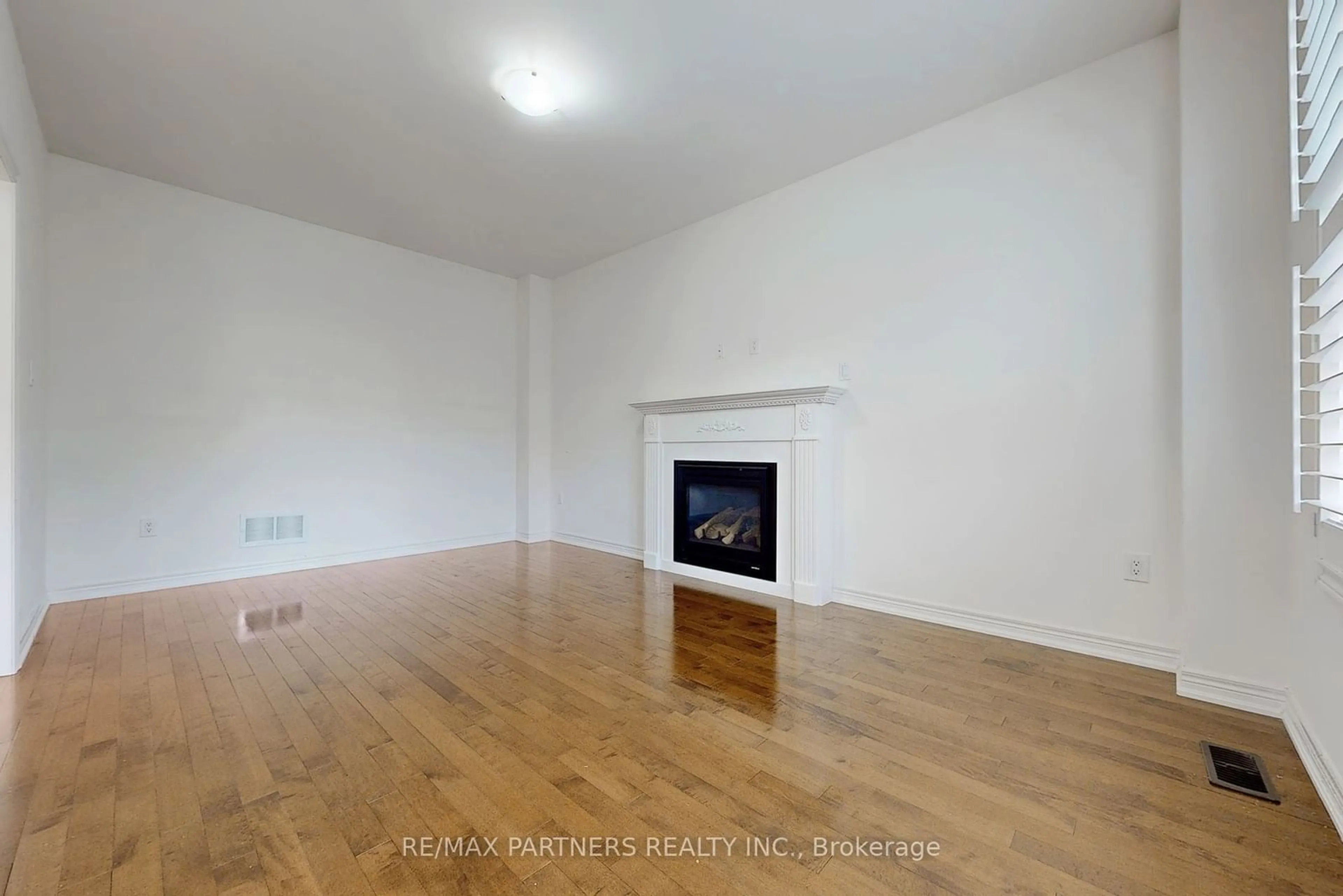 A pic of a room, wood floors for 73 Eakin Mill Rd, Markham Ontario L6E 1N9