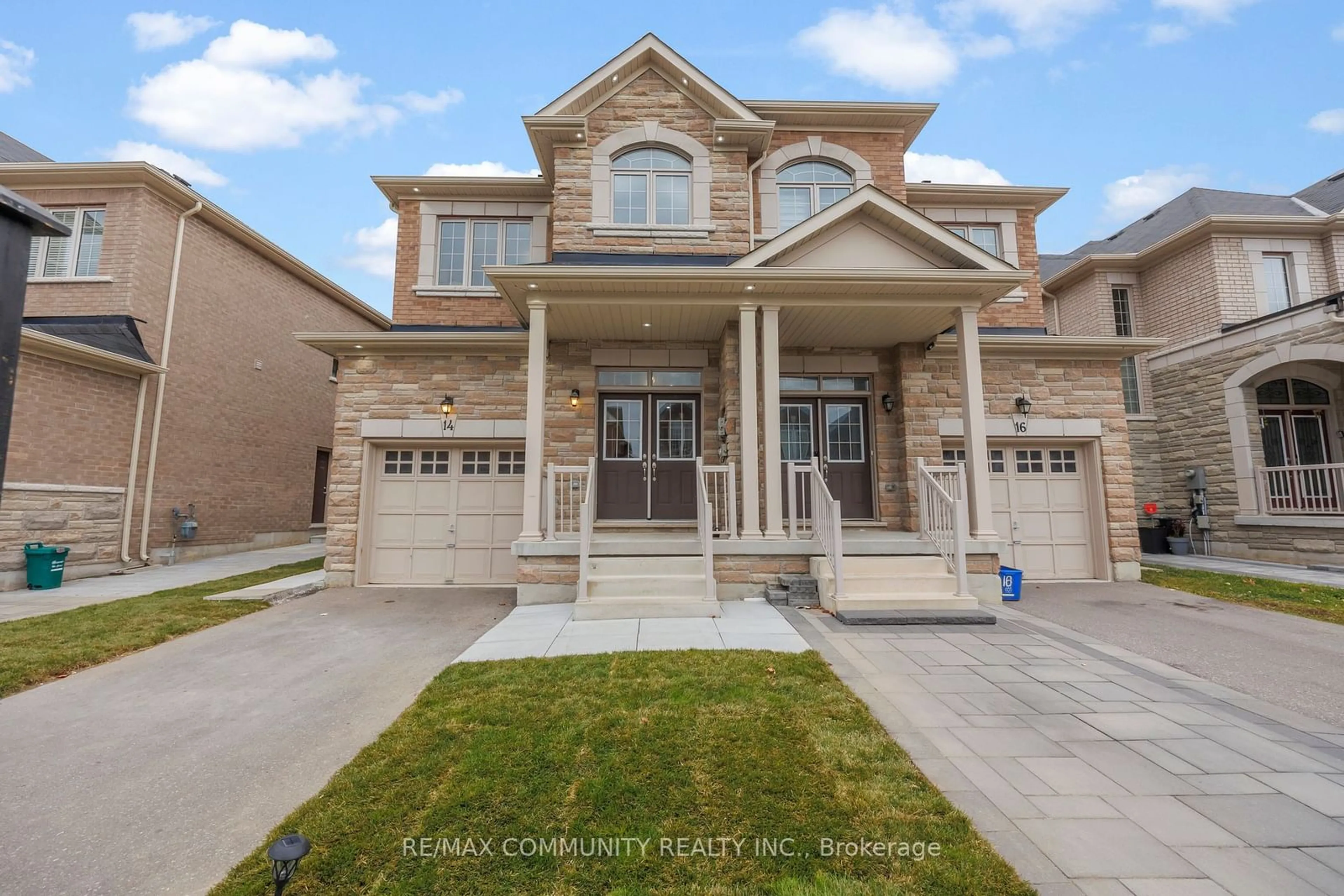 Frontside or backside of a home, the street view for 14 Mohandas Dr, Markham Ontario L3S 3J5