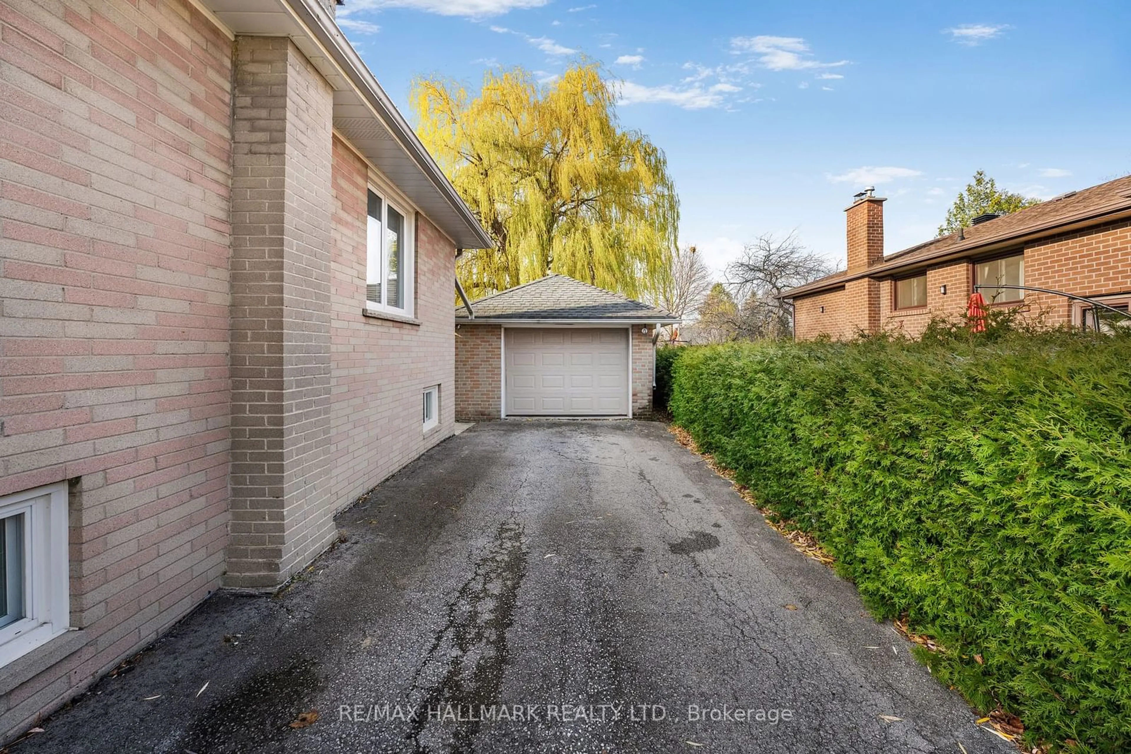 A pic from exterior of the house or condo, the fenced backyard for 216 Norfolk Ave, Richmond Hill Ontario L4C 2C9