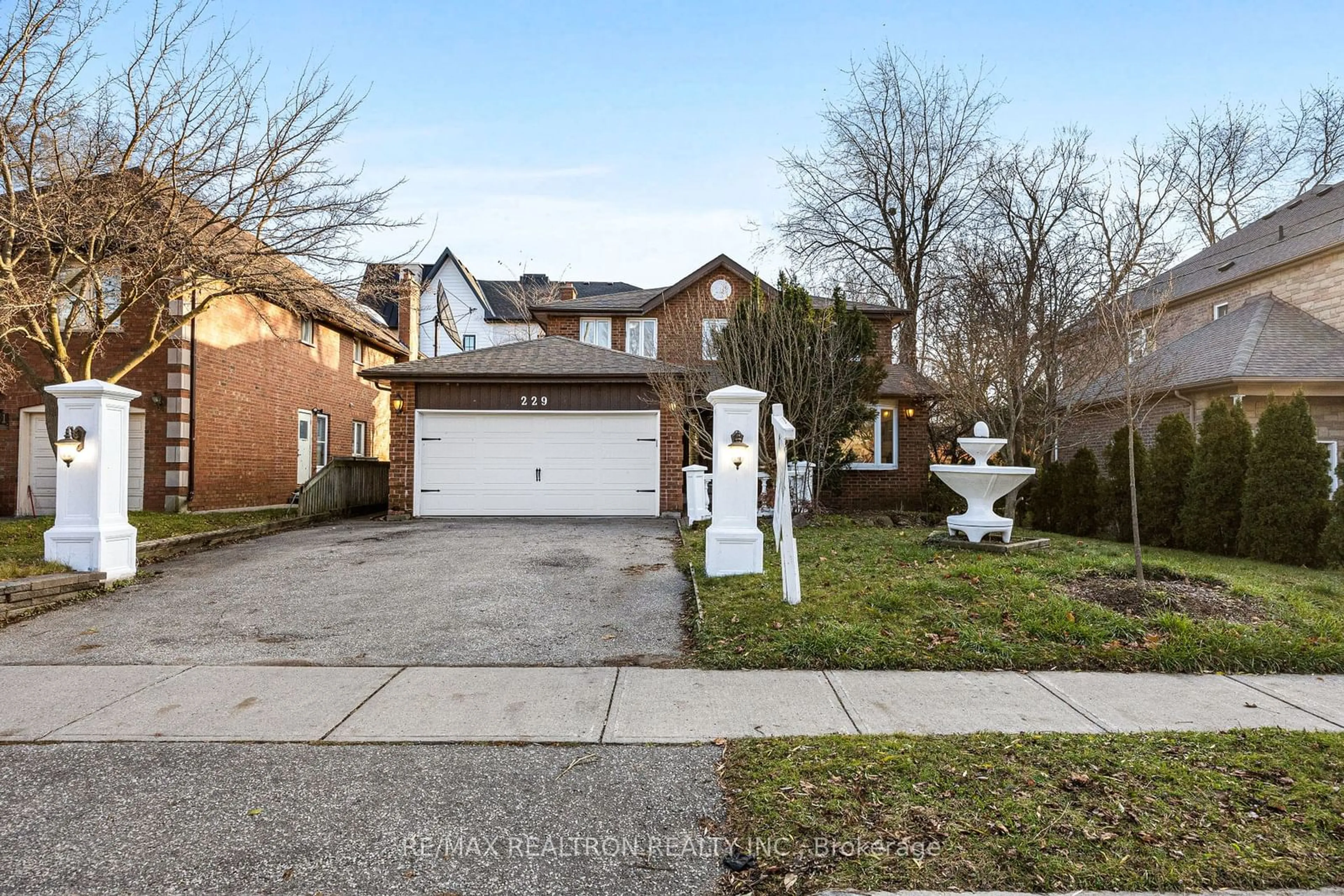 Frontside or backside of a home, the street view for 229 Douglas Rd, Richmond Hill Ontario L4E 3H8