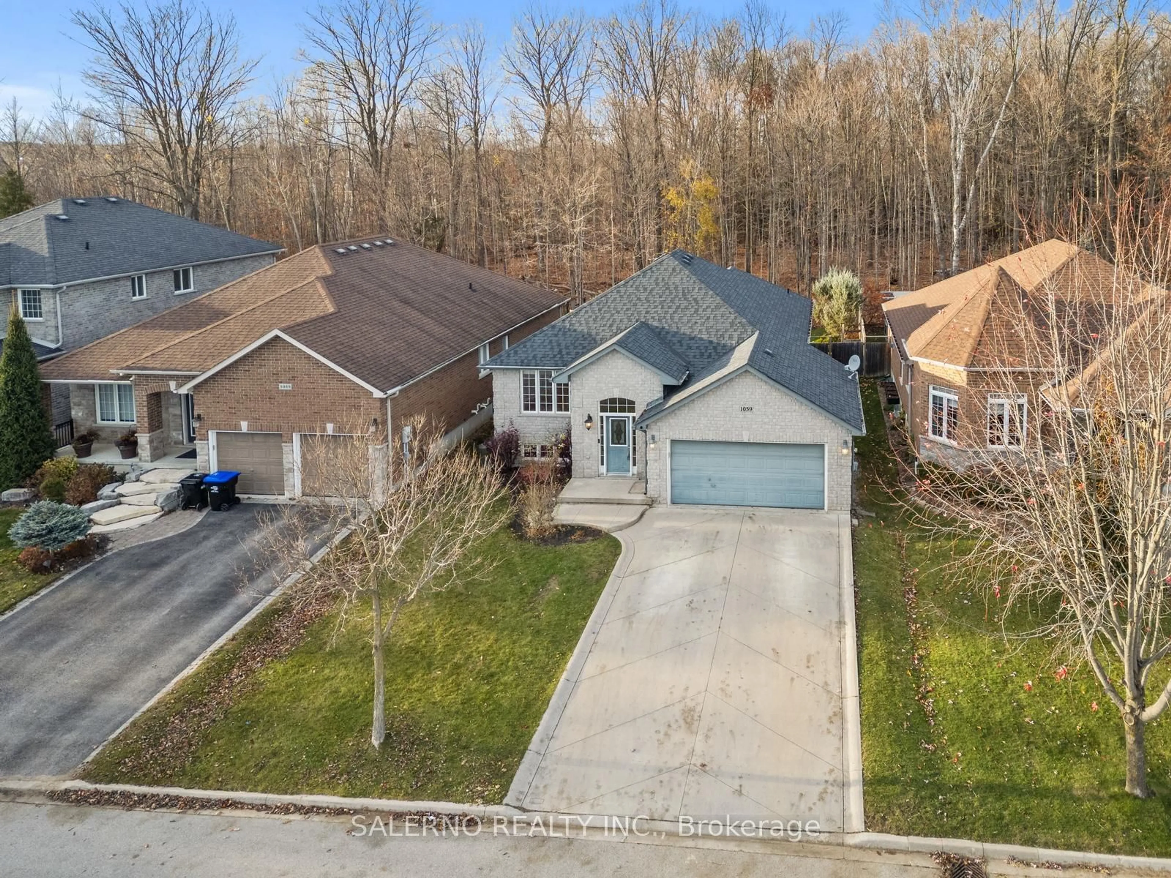 Frontside or backside of a home, the street view for 1059 Nantyr Dr, Innisfil Ontario L9S 0A8