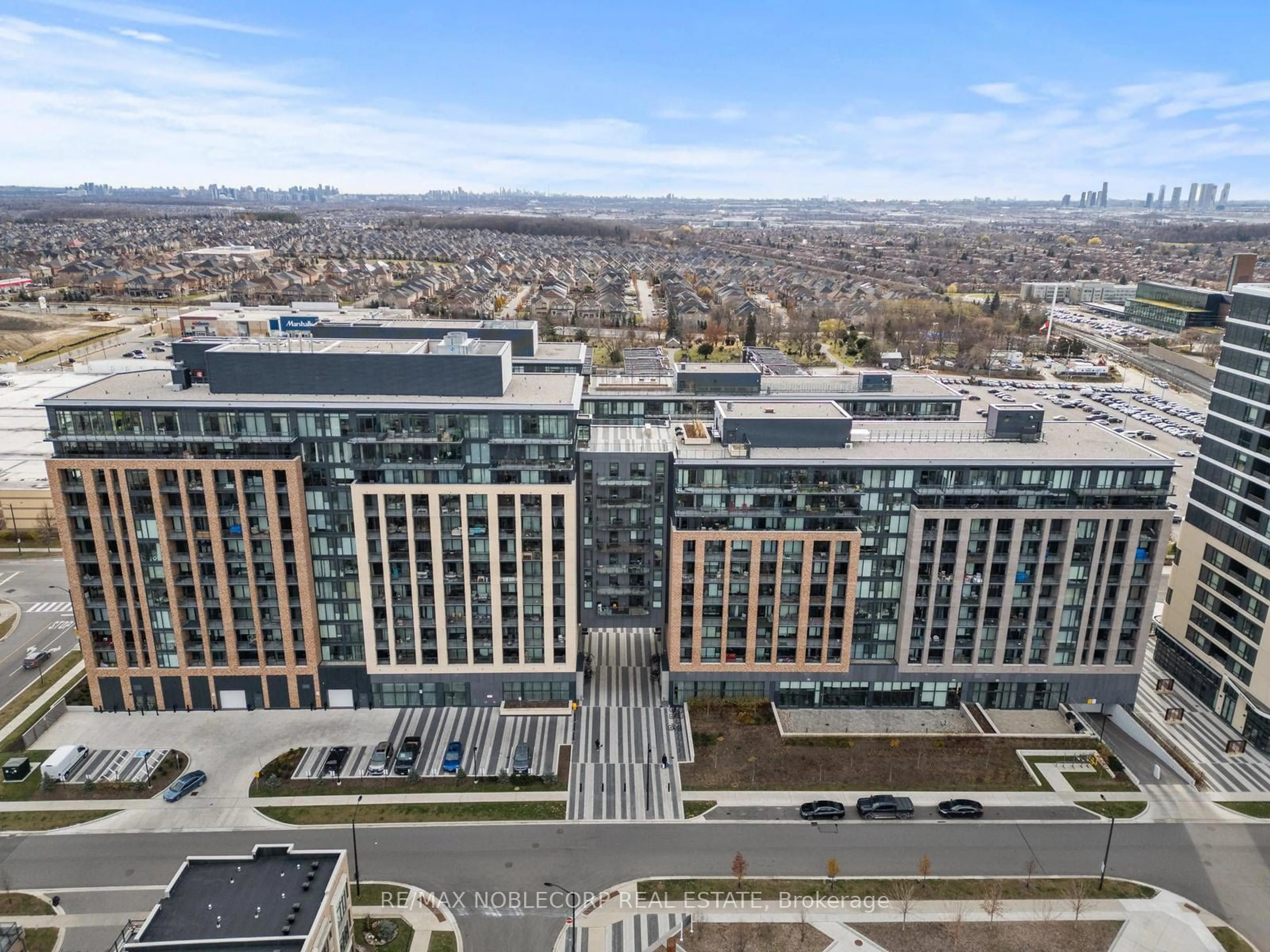 A pic from exterior of the house or condo, the view of city buildings for 100 Eagle Rock Way #313, Vaughan Ontario L6A 5B9