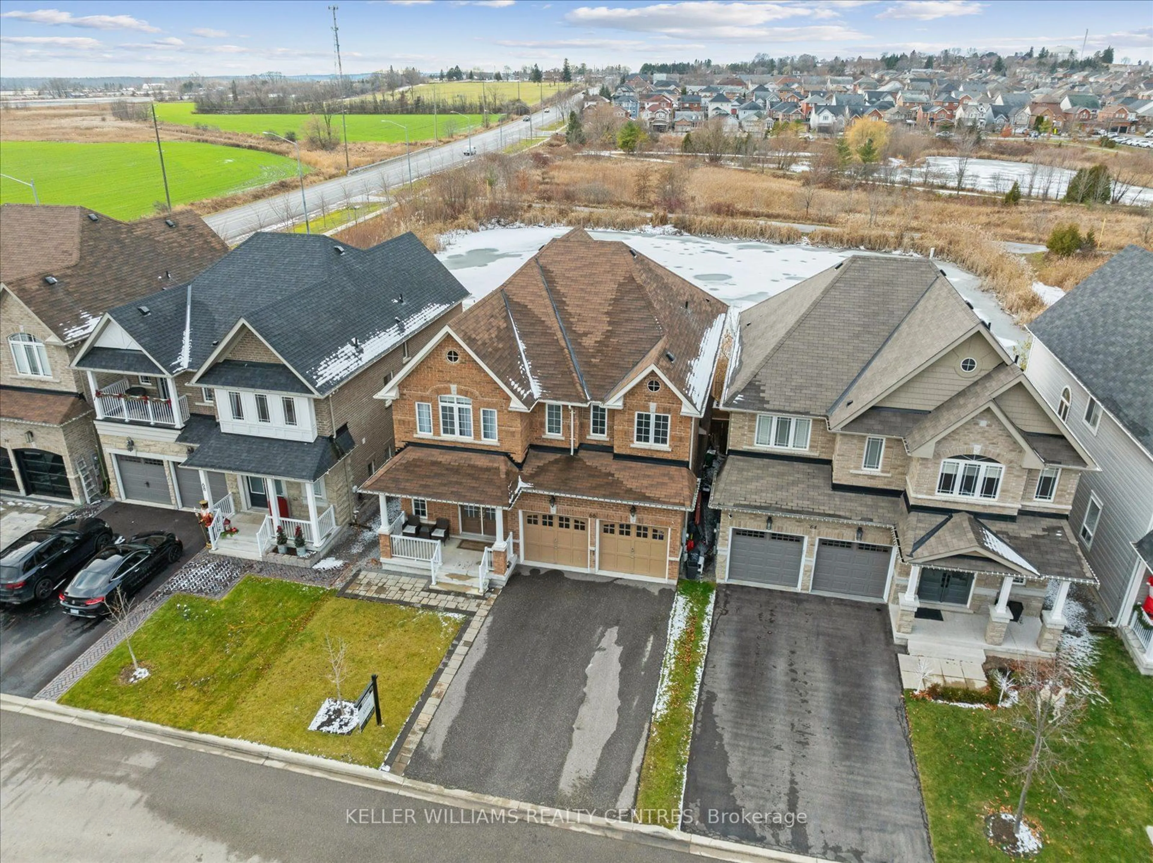 Frontside or backside of a home, the street view for 66 Robert Wilson Cres, Georgina Ontario L4P 0H1