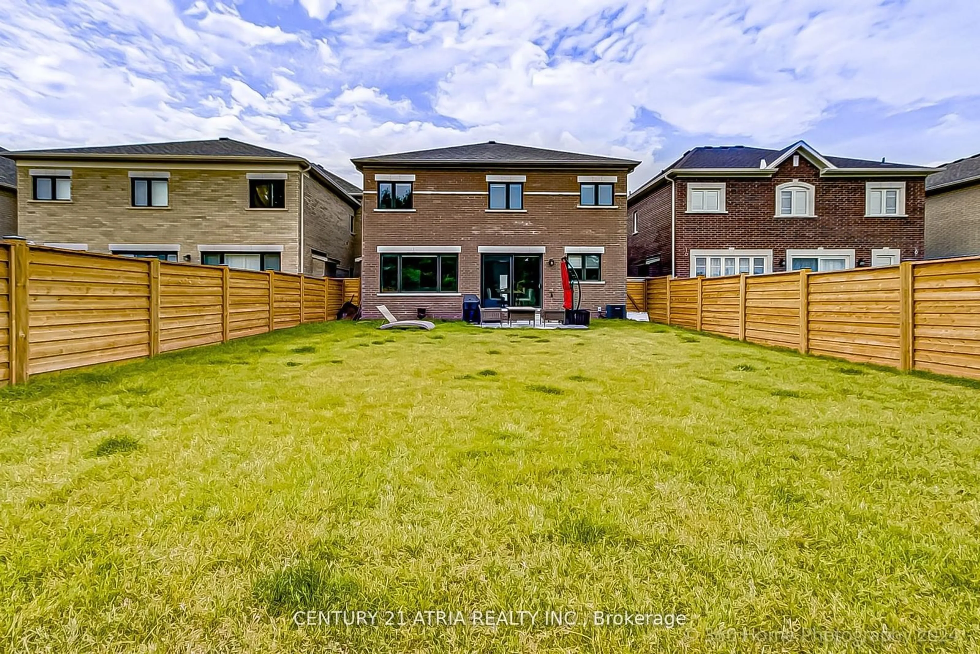 Frontside or backside of a home, the fenced backyard for 51 Woodhaven Ave, Aurora Ontario L4G 3Y1