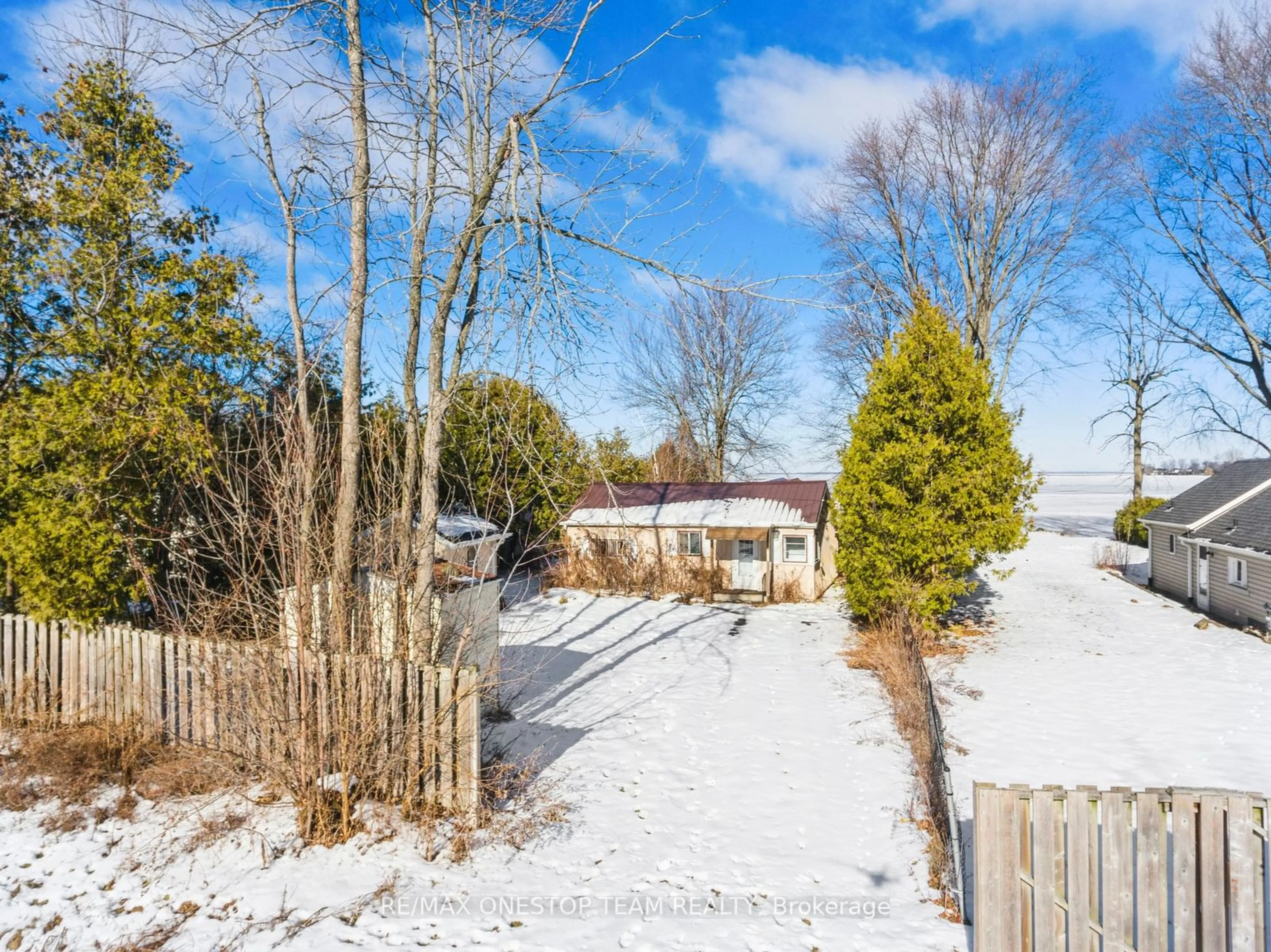 Frontside or backside of a home, the fenced backyard for 108 Moore's Beach Rd, Georgina Ontario L0E 1N0