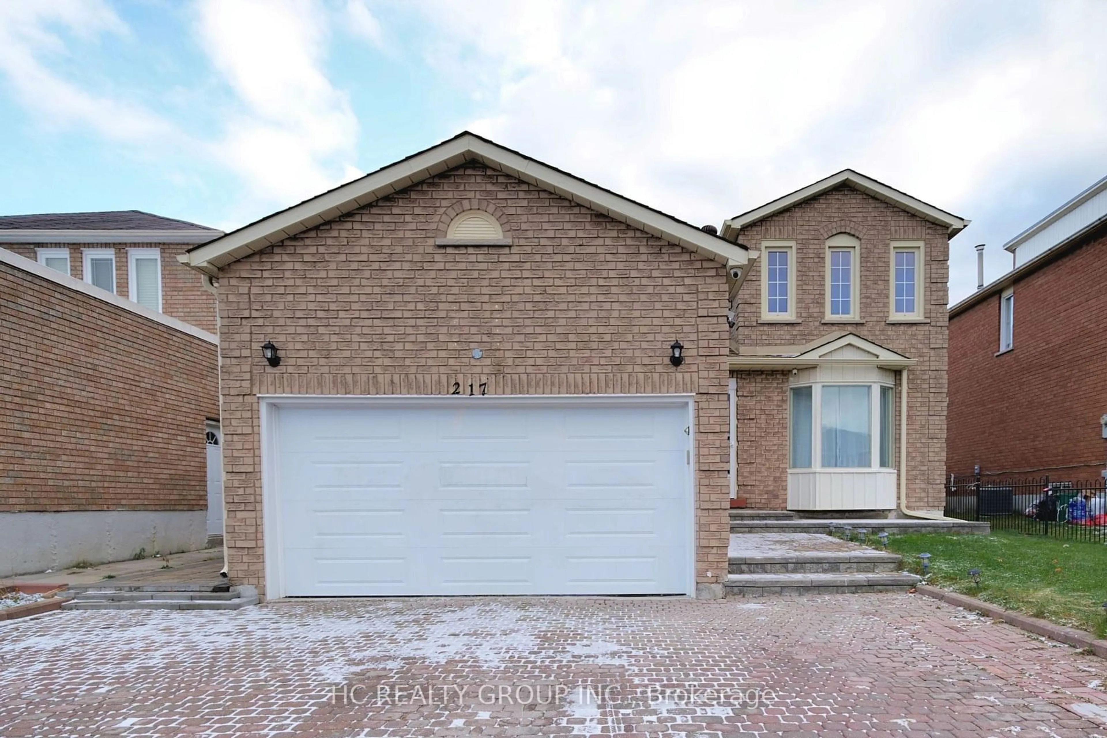 Home with brick exterior material for 217 Highglen Ave, Markham Ontario L3S 1Y4