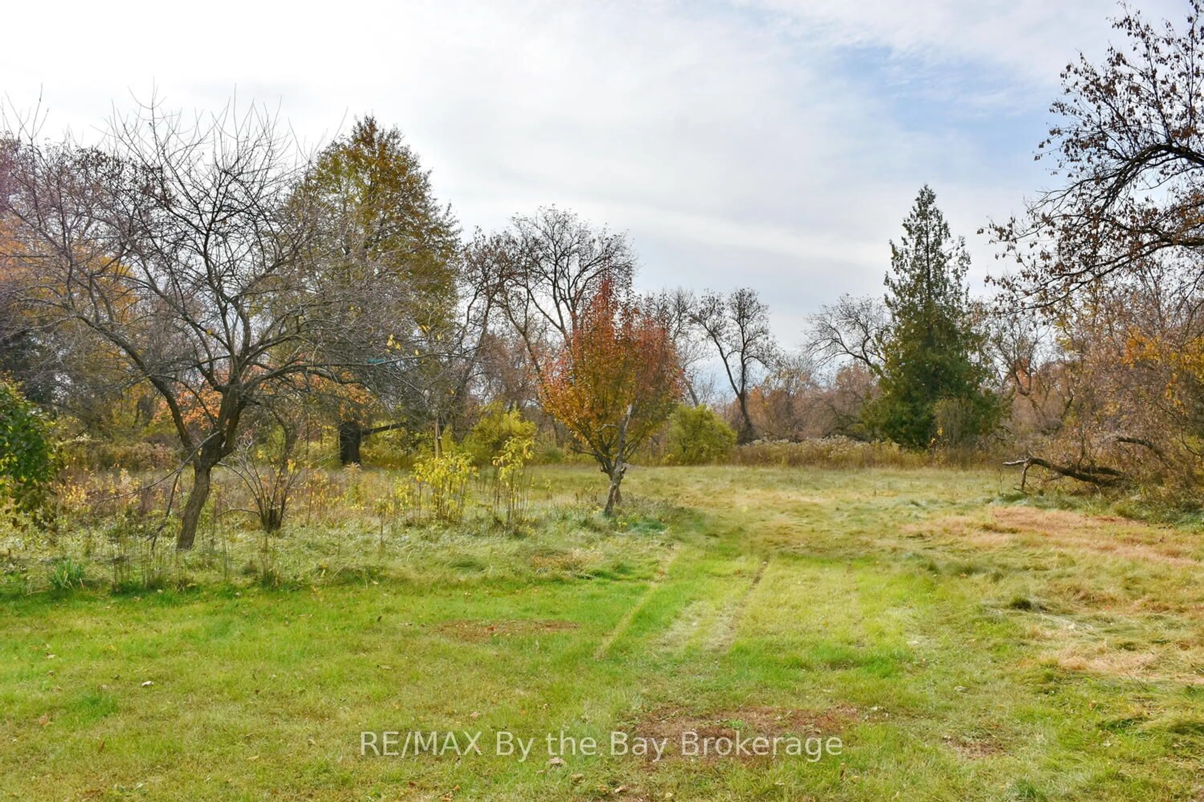 A pic from exterior of the house or condo, the fenced backyard for 390 Mill St, Essa Ontario L0M 1B4