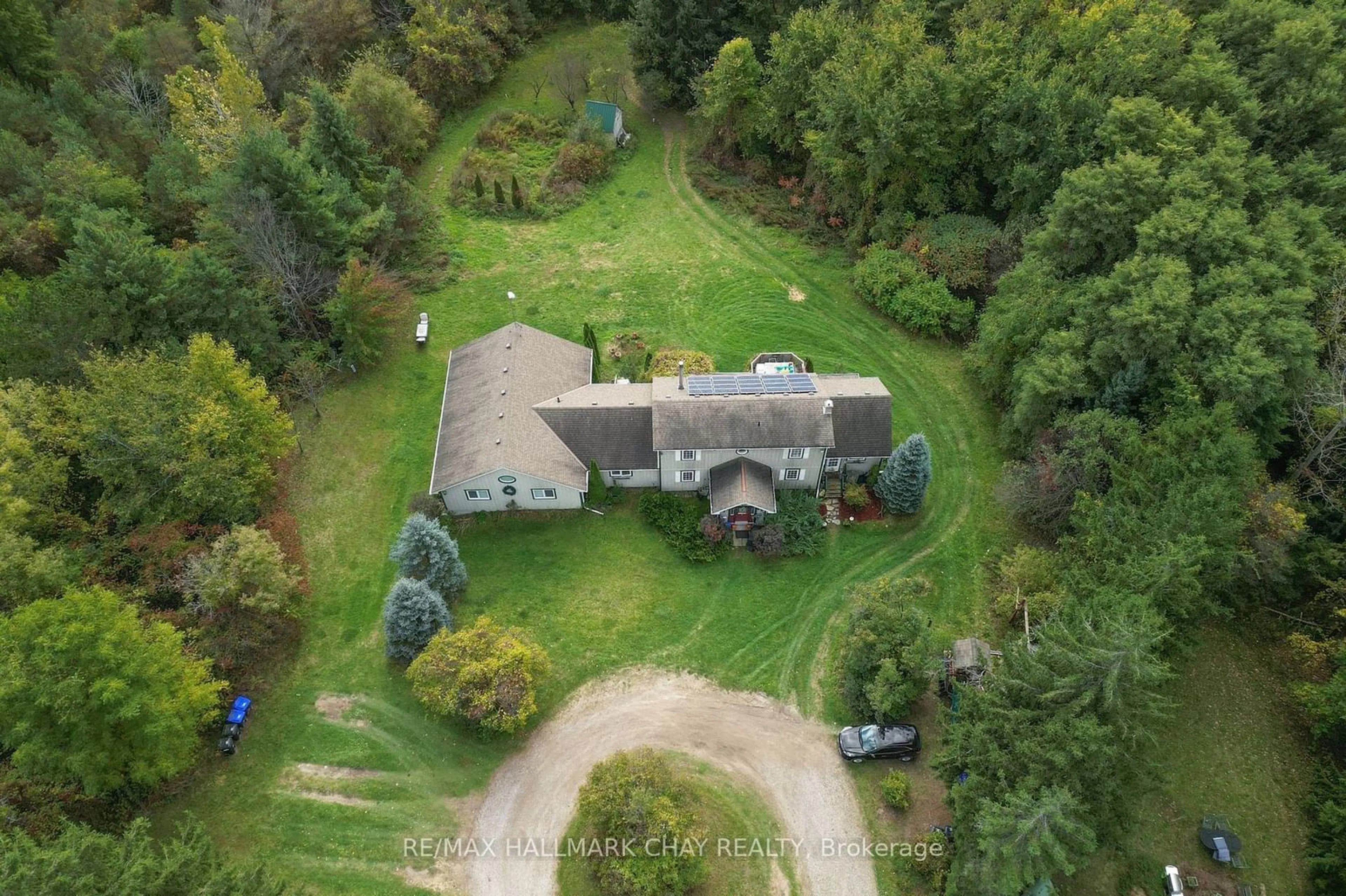 A pic from outside/outdoor area/front of a property/back of a property/a pic from drone, forest/trees view for 6509 13th Line, New Tecumseth Ontario L9R 1V4