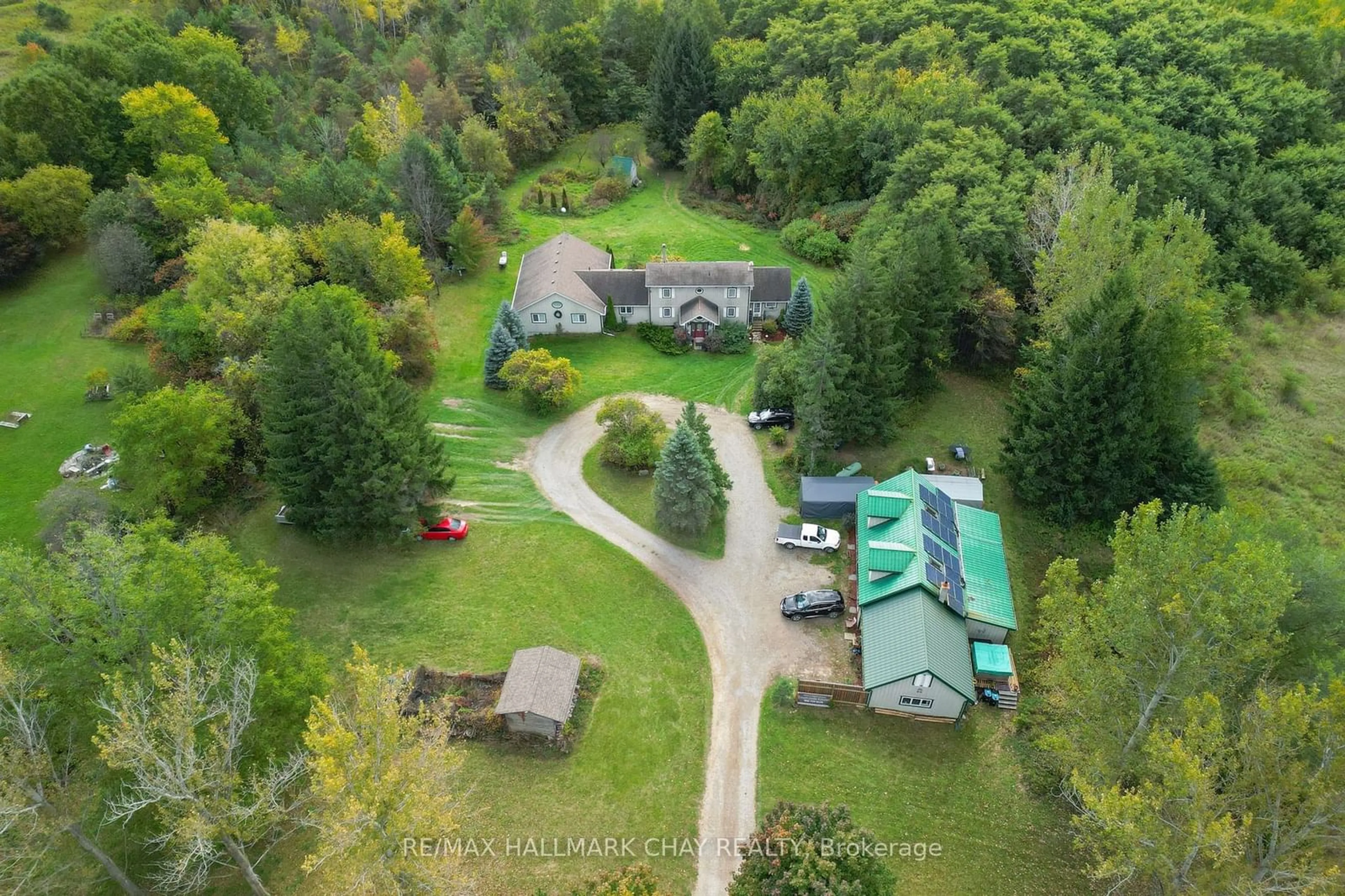 A pic from outside/outdoor area/front of a property/back of a property/a pic from drone, forest/trees view for 6509 13th Line, New Tecumseth Ontario L9R 1V4