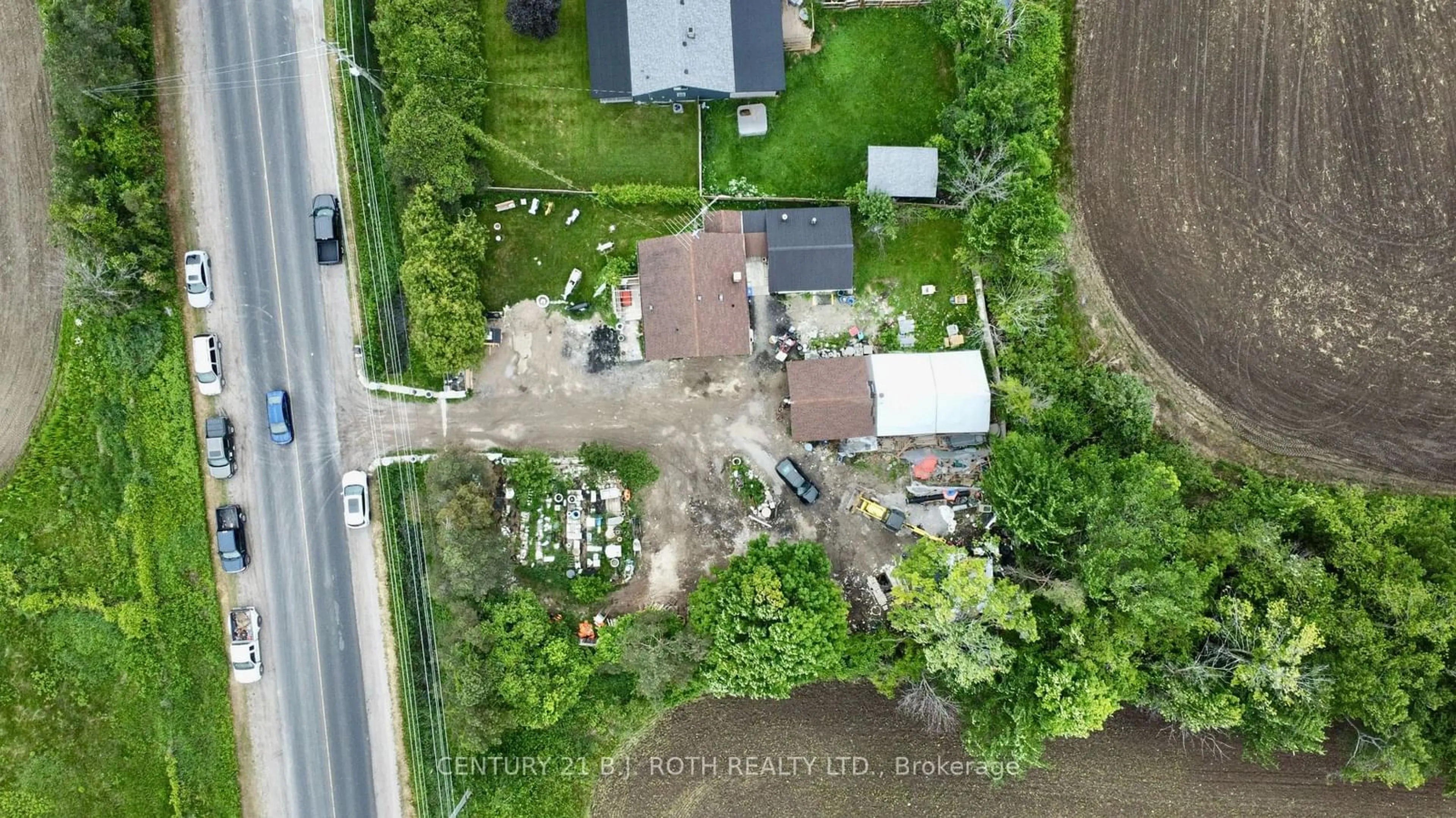 A pic from outside/outdoor area/front of a property/back of a property/a pic from drone, street for 1231 10th Line, Innisfil Ontario L9S 3N5