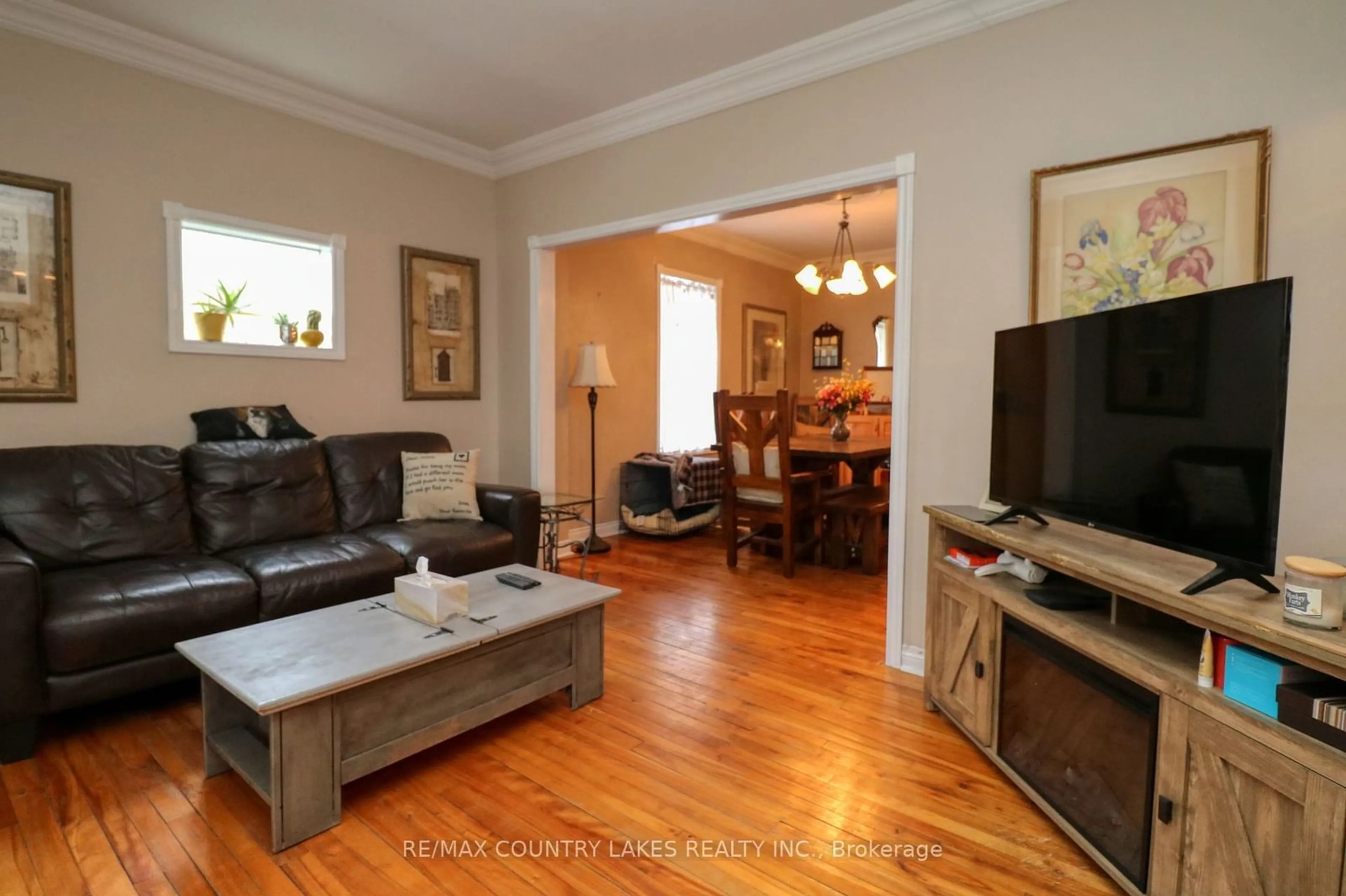 Living room with furniture, wood/laminate floor for 439 Osborne St, Brock Ontario L0K 1A0