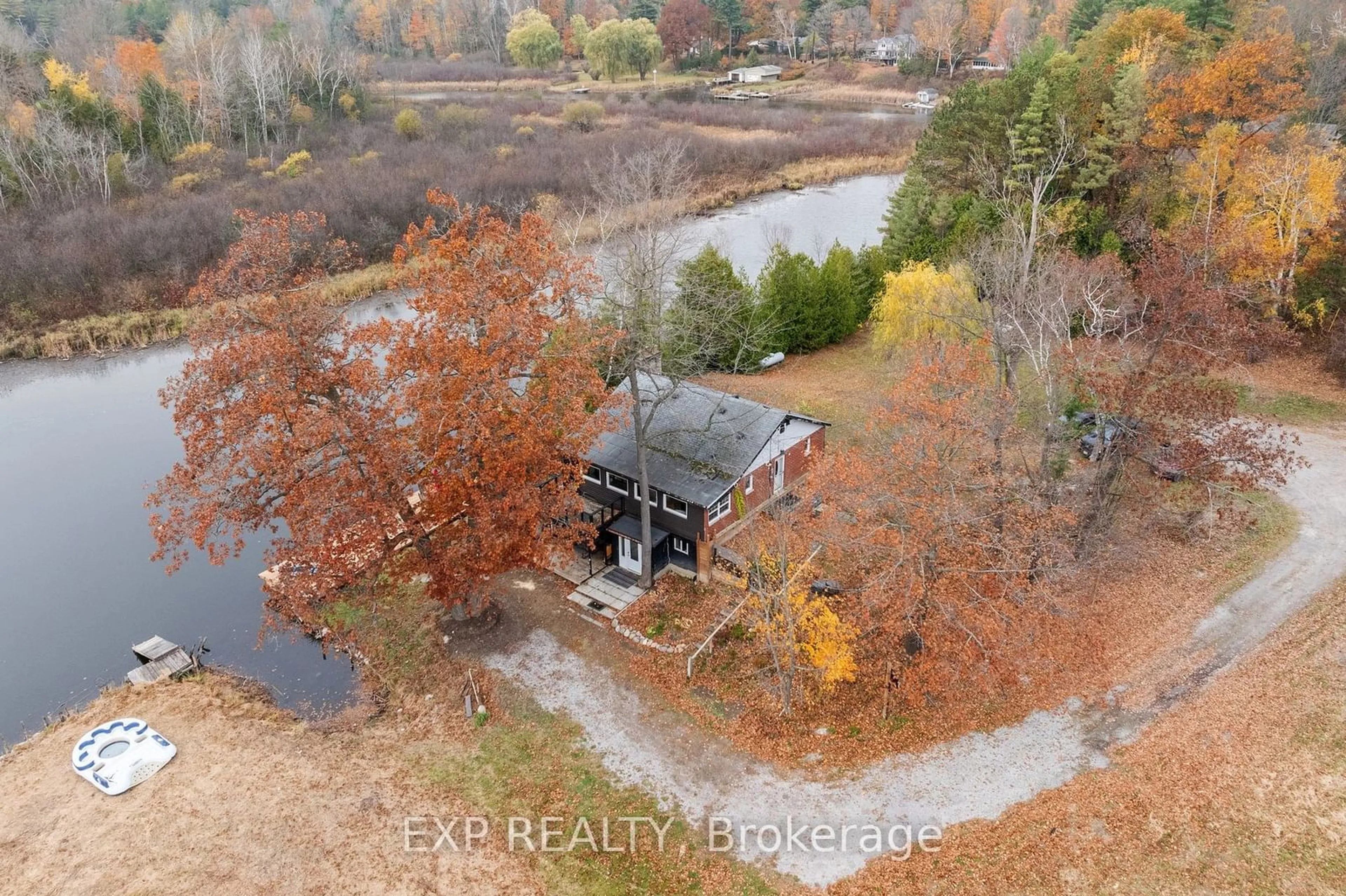 A pic from outside/outdoor area/front of a property/back of a property/a pic from drone, water/lake/river/ocean view for 1 Birch Knoll Rd, Georgina Ontario L0E 1R0