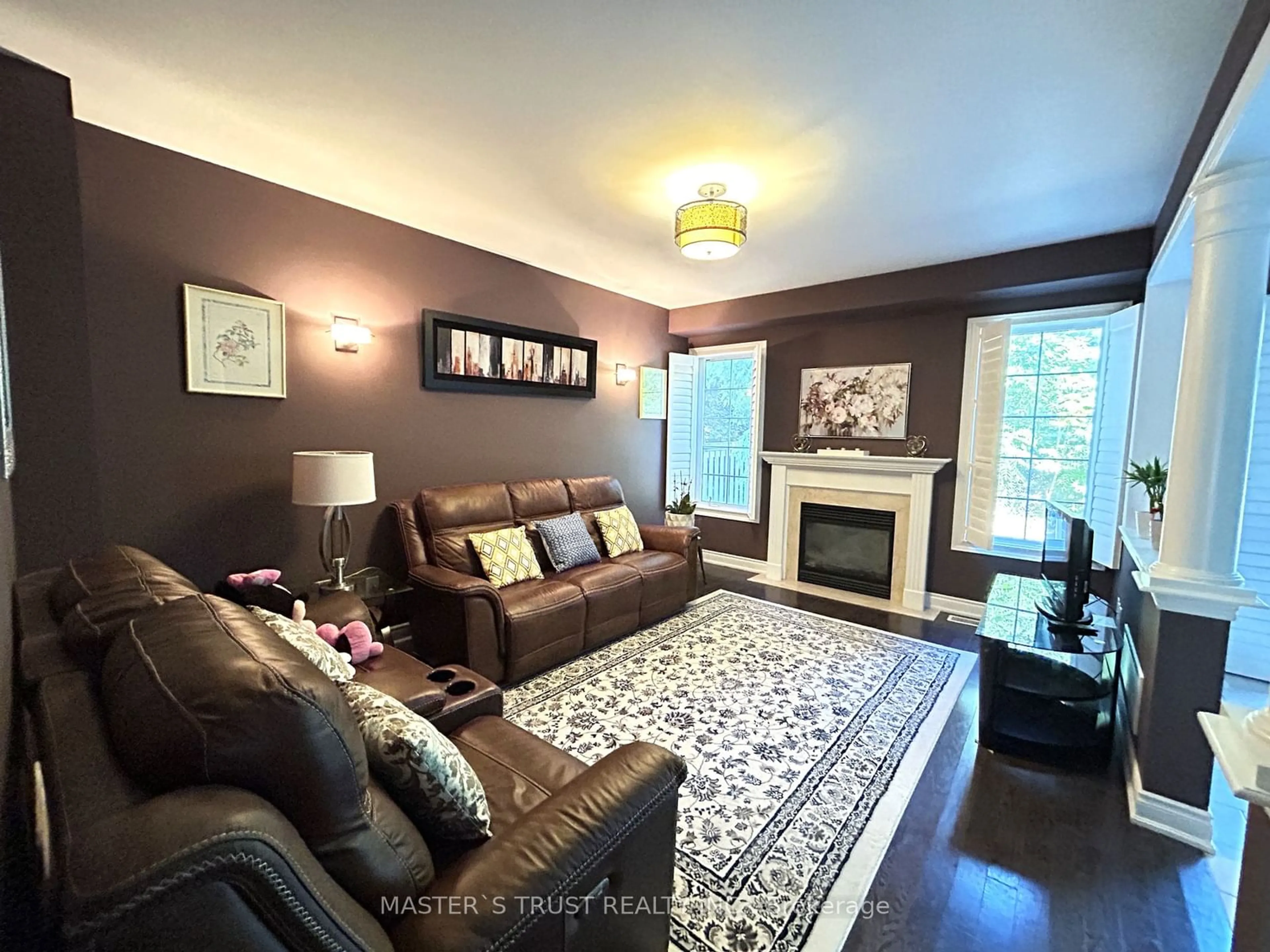 Living room with furniture, wood/laminate floor for 1074 Nellie Little Cres, Newmarket Ontario L3X 3E3