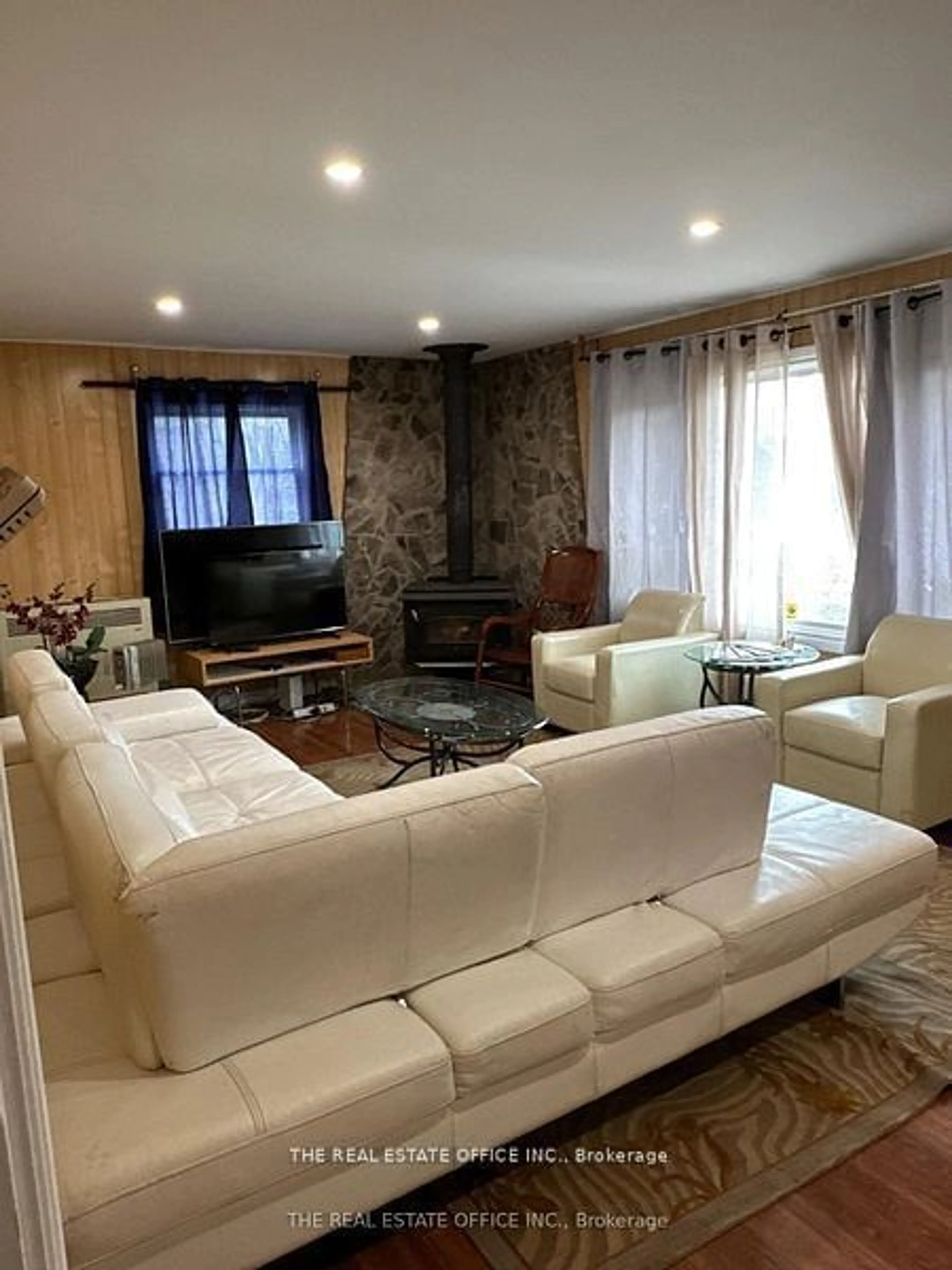 Living room with furniture, wood/laminate floor for 393 Adeline Dr, Georgina Ontario L4P 3C4